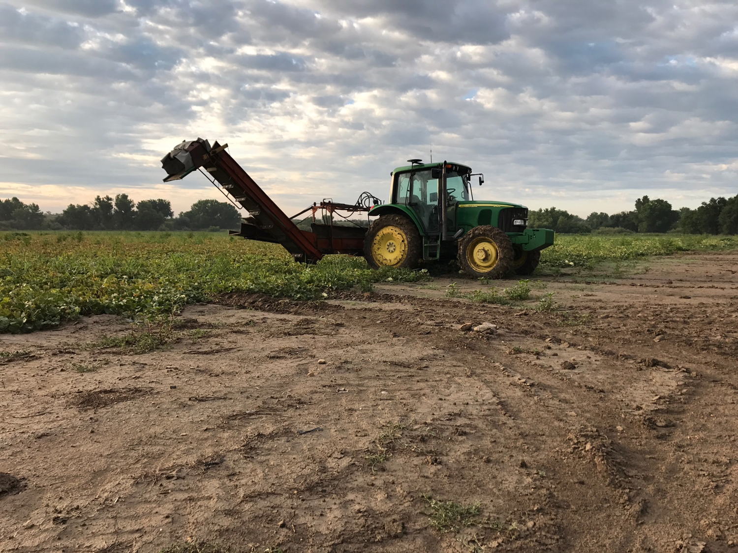 A tractor waits out a rain storm and muddy field during the 2017 season. 
