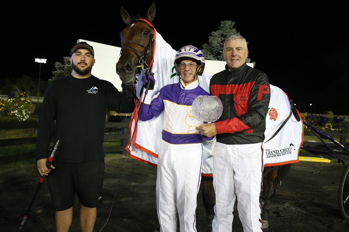 Test Of Faith connections in the winner's circle of the Roses Are Red Final at Woodbine Mohawk Park. (New Image Media)