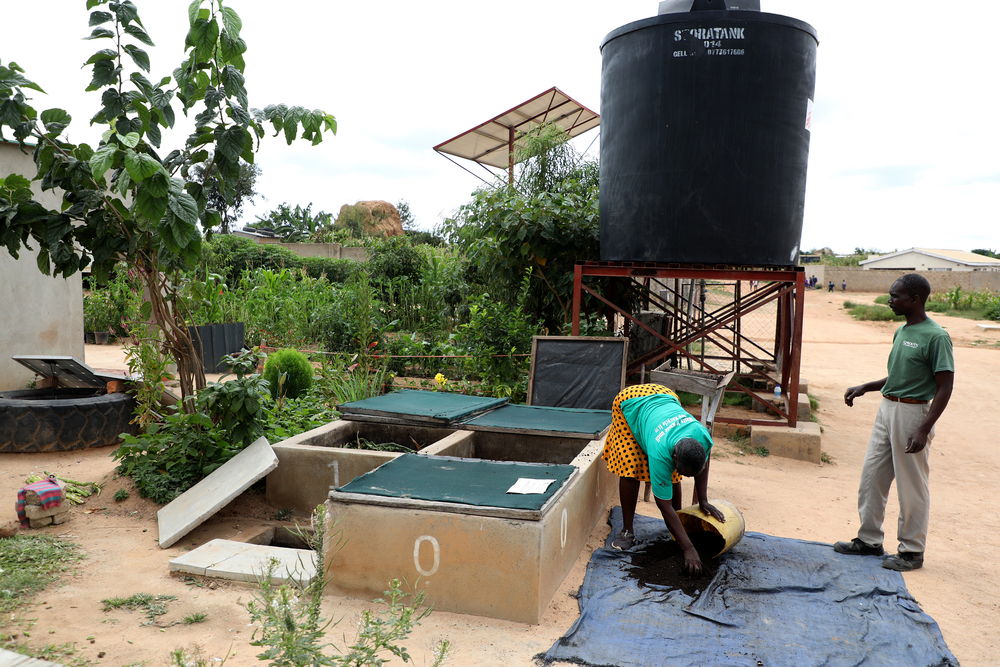 Benhilda Mutungira sorts through material at the bio-waste recycling project. The community of Stoneridge is visibly thriving thanks to the provision of recycled water and biofertilizer that feeds the land. Photographer: Manzongo John