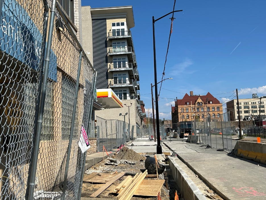 Ongoing installation of new sidewalk, curb and light pole at Fifth Avenue and Marion Street
