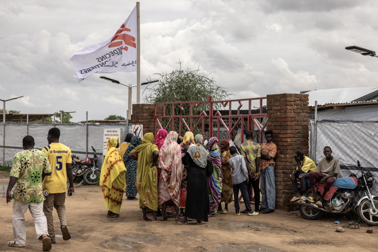 Date taken / Date Recorded: 07 August, 2024 Caption / Description: Women wait to enter the ground of the MSF Hospital in Metche, in eastern Chad, August 7, 2024. Metche camp hosts about 40,000 Sudanese refugees who have fled violence in Darfur. Finbarr O’Reilly/VII Photo.
