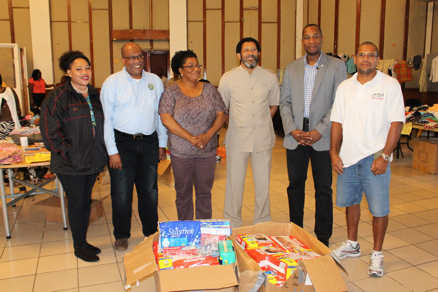 Governor, ECCB - Timothy N. J. Antoine (5th from left) with Deputy Governor, Trevor Brathwaite (2nd from left), ECCB Resident Representative for Antigua and Barbuda – Albert Lockhart (4th from left) and Coordinator and Volunteers at Hurricane Shelter, Antigua.