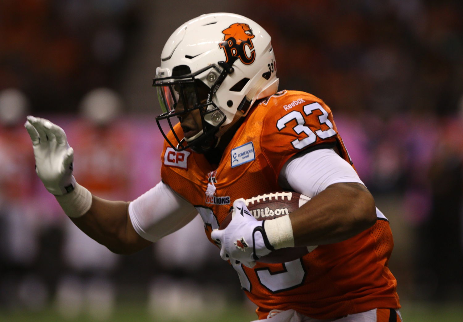 Andrew Harris rushes the ball for the B.C. Lions during a game this season.