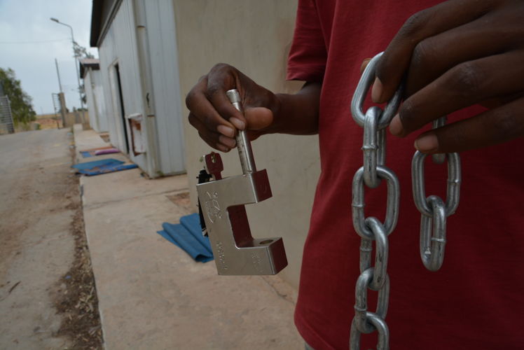 5) Earlier this year, some 50 of the detainees in the poorest health were transferred from Zintan to Gharyan detention centre, which became a heavily militarised area when the LNA took control of it in the course of its offensive on Tripoli in April. 

Detainees were provided by the detention centre management with a chain and padlock – reportedly to protect themselves against incursions by armed elements in the absence of guards. 

On 26 June, 29 people were still in Gharyan detention centre when GNA forces recaptured the town after heavy fighting that included airstrikes. Detainees were in fear for their lives, with nowhere to go in the middle of the battle. 

One week later, they were finally relocated to Tripoli: eight referred for hospital treatment by MSF and 21 referred to an NGO-run shelter programme. © Jérôme Tubiana/MSF