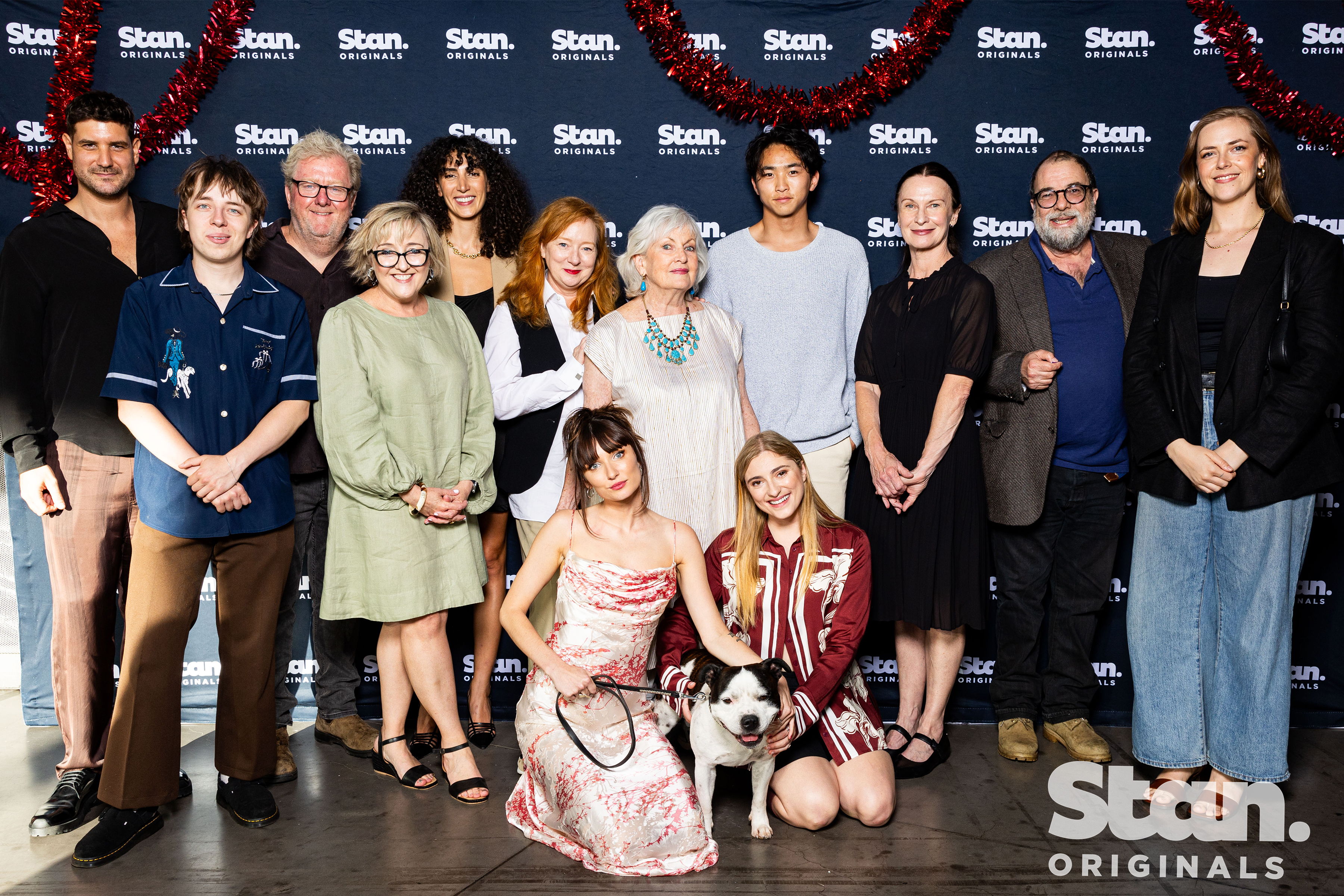 L-R: Claude Jabbour, Ed Oxenbould, Steve Rodgers, Naomi Just (producer), Priscilla Doueihy, Mandy McElhinney, Diana McLean, Lelong Hu, Tara Morice, Tiriel Mora, Imogen McCluskey (director). Front: Jenna Owen, Vic Zerbst and Reuben (Nugget) ​