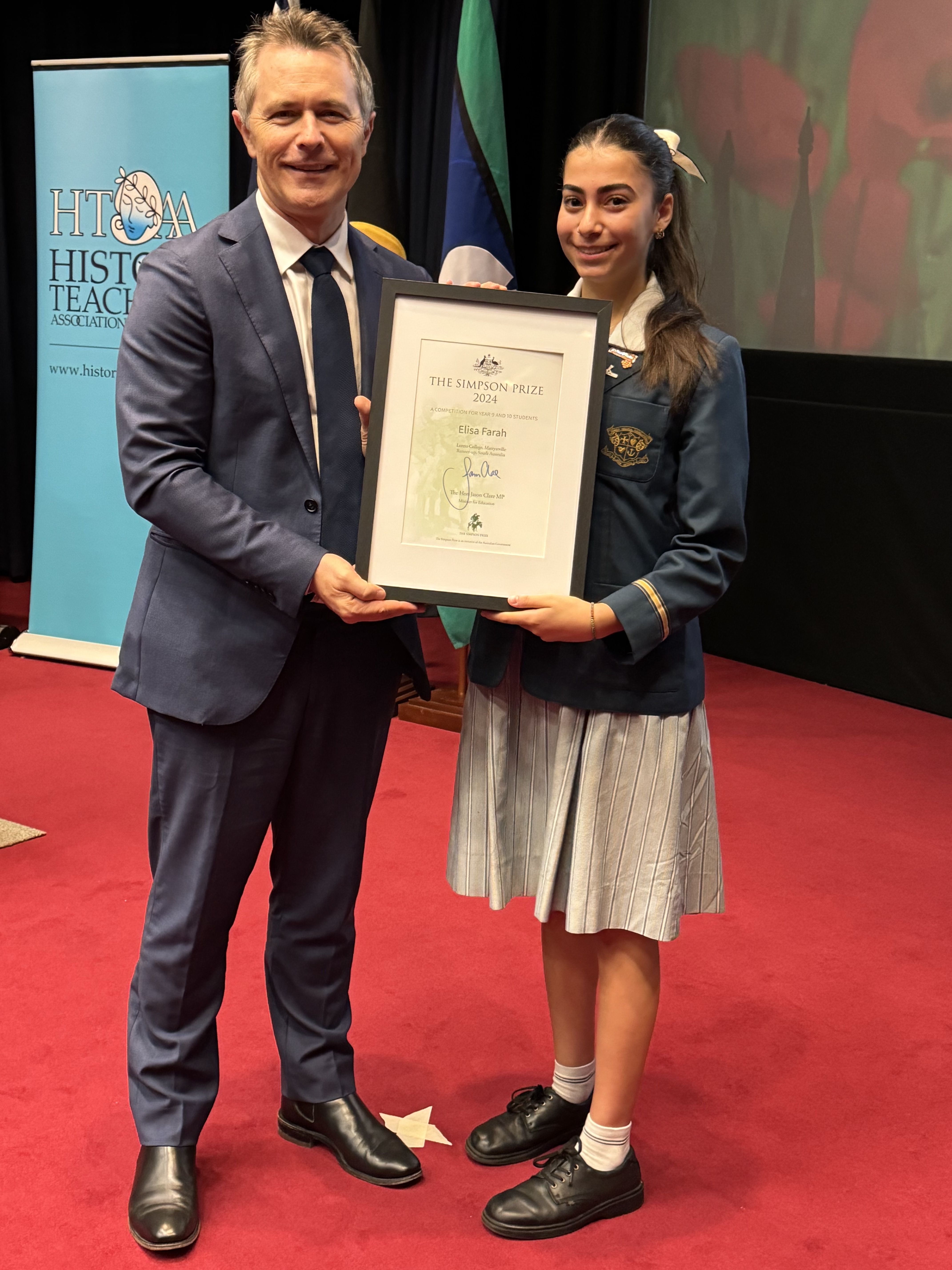 The Hon. Jason Clare MP presenting Elisa Farah with the 2024 Simpson Prize Runner-Up Award