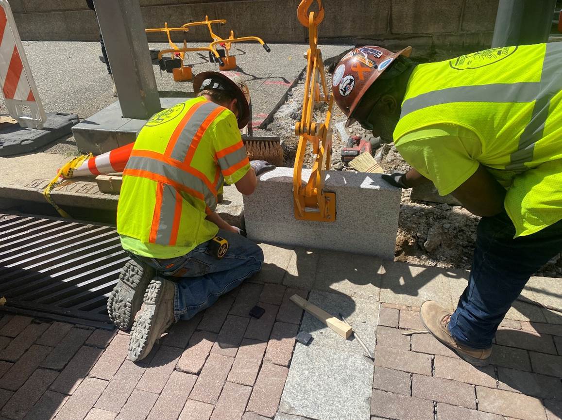 Granite curb is being installed at Fifth Avenue and Grant Street along with a new accessible ramp Granite curb is being installed at Fifth Avenue and Grant Street along with a new accessible ramp