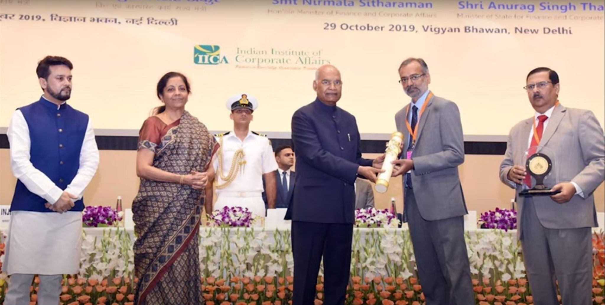 Mr Ram Nath Kovind, President of India, presents the award to Mr K Sreekant and Mr Ravi P Singh, CMD and Director (Personnel) of POWERGRID, respectively. Ms Nirmala Sitharaman, Minister of Finance and Minister of Corporate Affairs, looks on. Mr Ram Nath Kovind, President of India, presents the award to Mr K Sreekant and Mr Ravi P Singh, CMD and Director (Personnel) of POWERGRID, respectively. Ms Nirmala Sitharaman, Minister of Finance and Minister of Corporate Affairs, looks on.