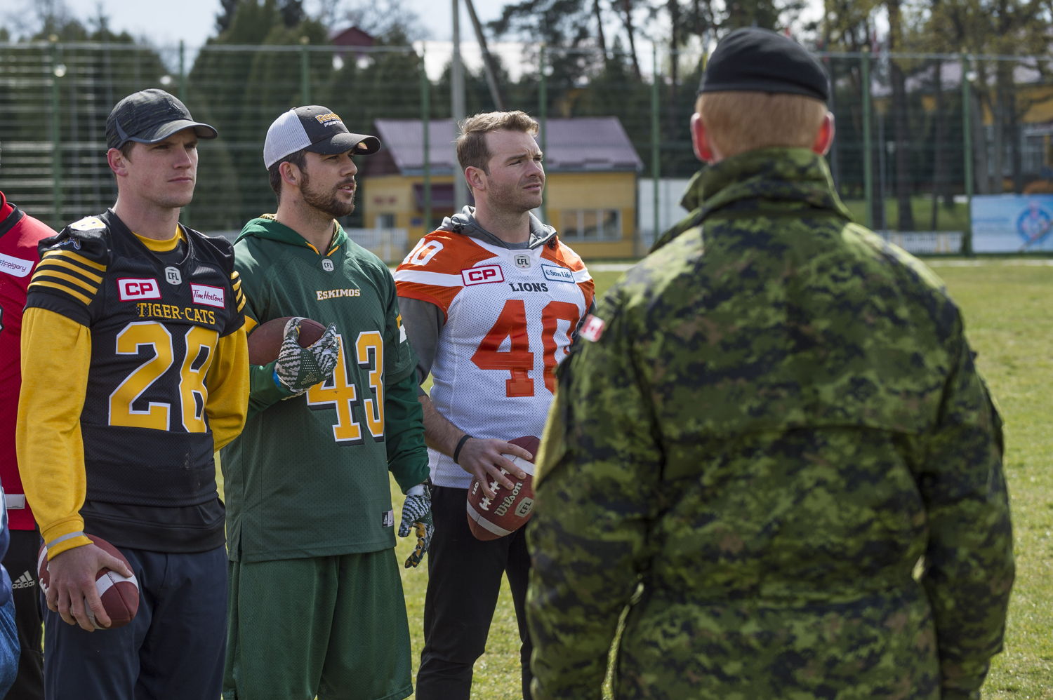 Craig Butler (L), Neil King (C), and Mike Benson (R) with members of the Canadian Forces in Lviv, Ukraine. Photo: MCpl Mathieu Gaudreault, Canadian Forces Combat Camera