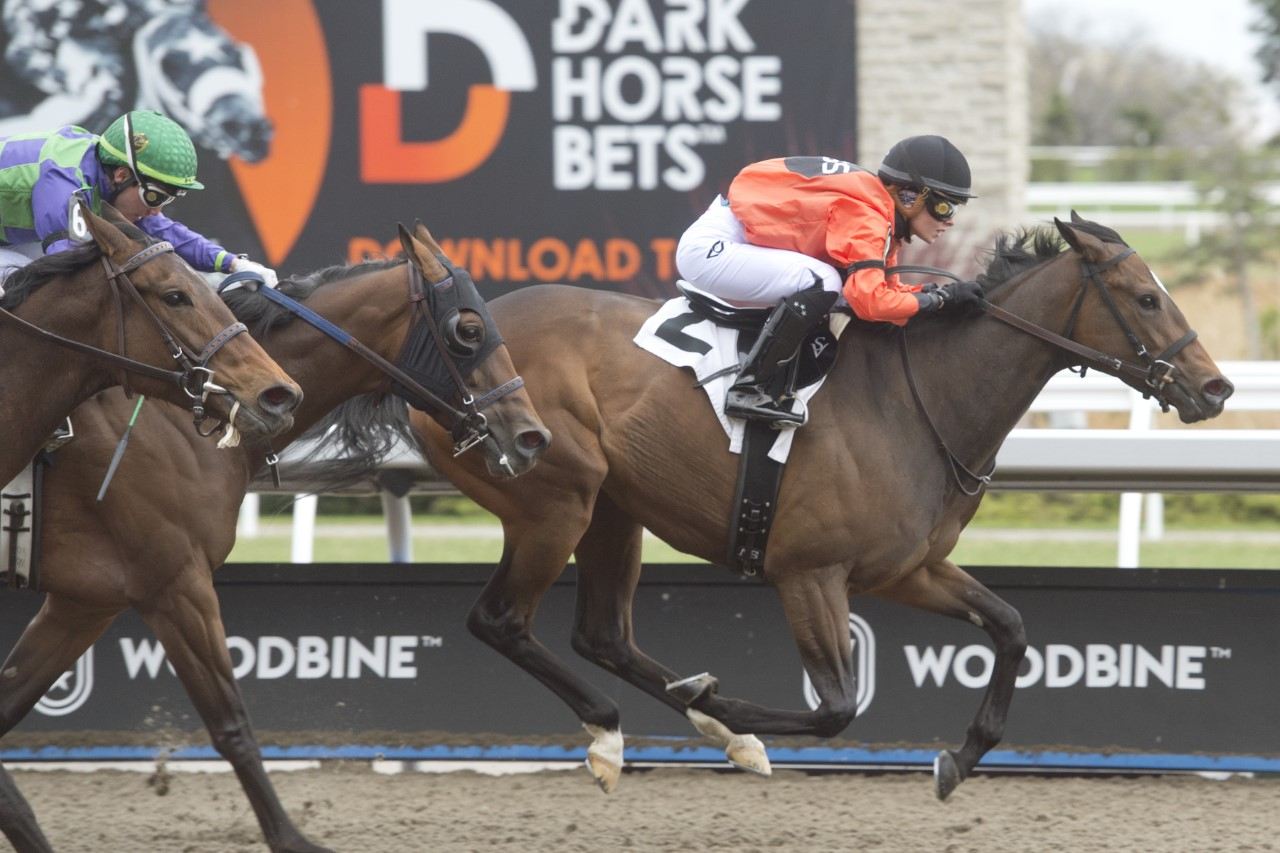Popnfizz and jockey Sofia Vives winning on the Woodbine Tapeta on April 23, 2023 (Michael Burns Photo)
