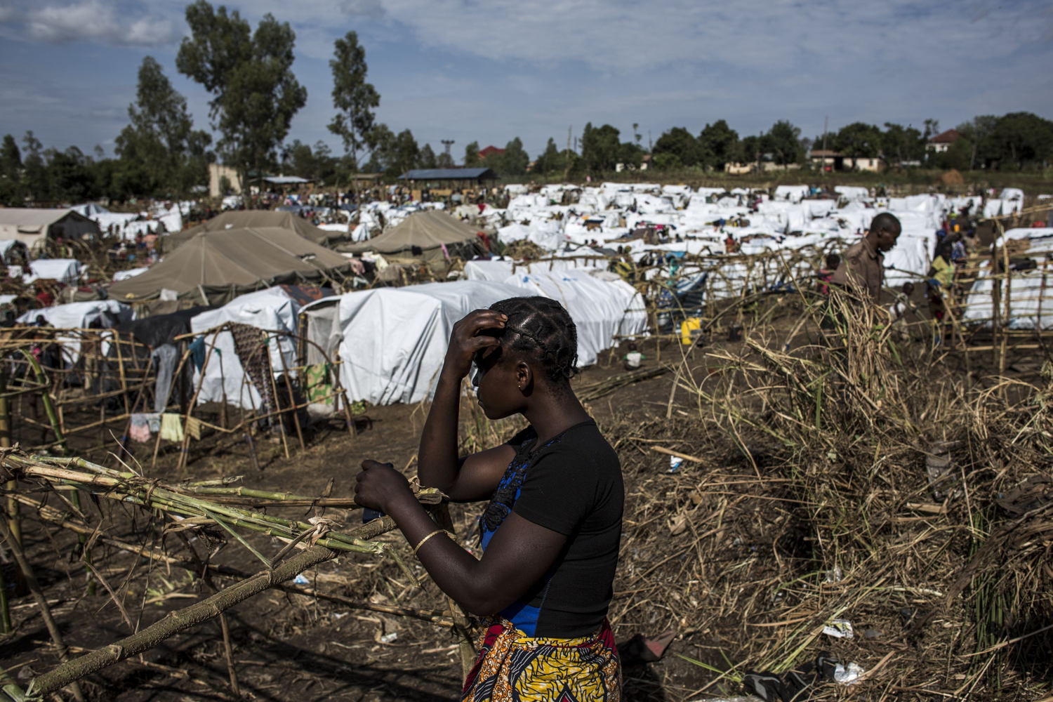 An internally displaced Congolese woman is seen inside an MSF-supported IDP camp. The camp is estimated to be home to around 2,000 IDPs, with this number expected to increase as the violence continues. PHOTO/JOHN WESSELS