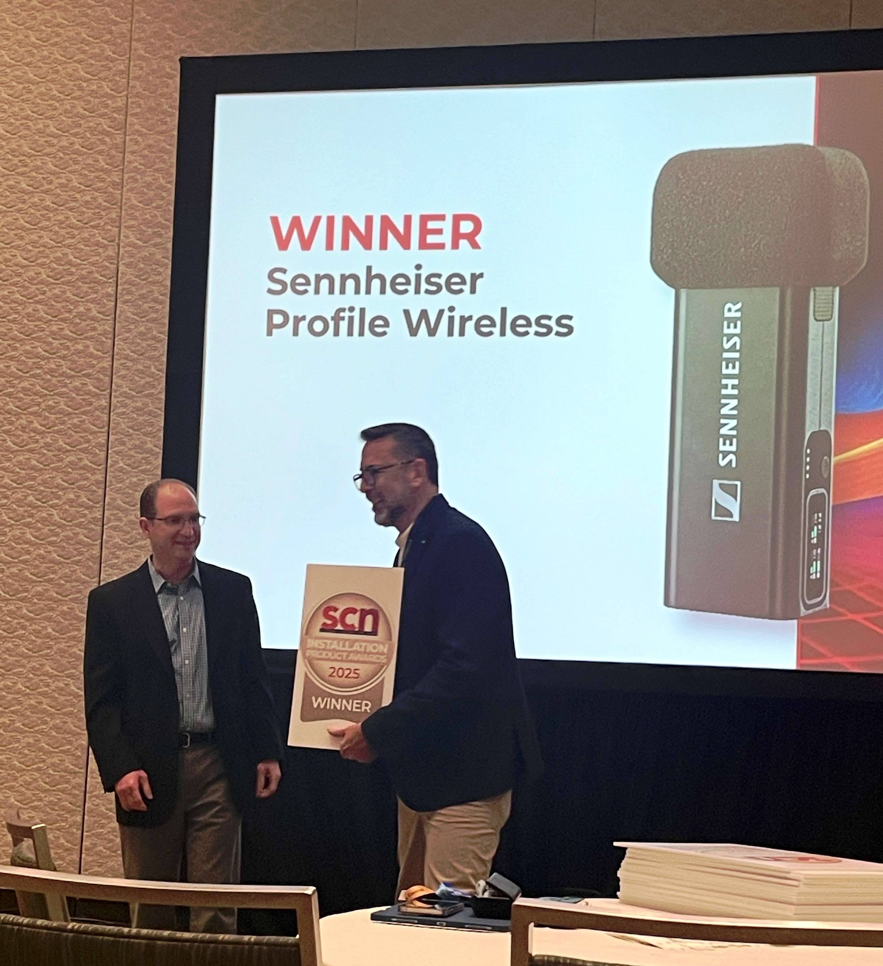 Sennheiser’s Hugo Caballero, Trade Marketing Manager, Pro Audio, accepting SCN’s Installation Product Award for the Profile Wireless 2-Channel Microphone System.