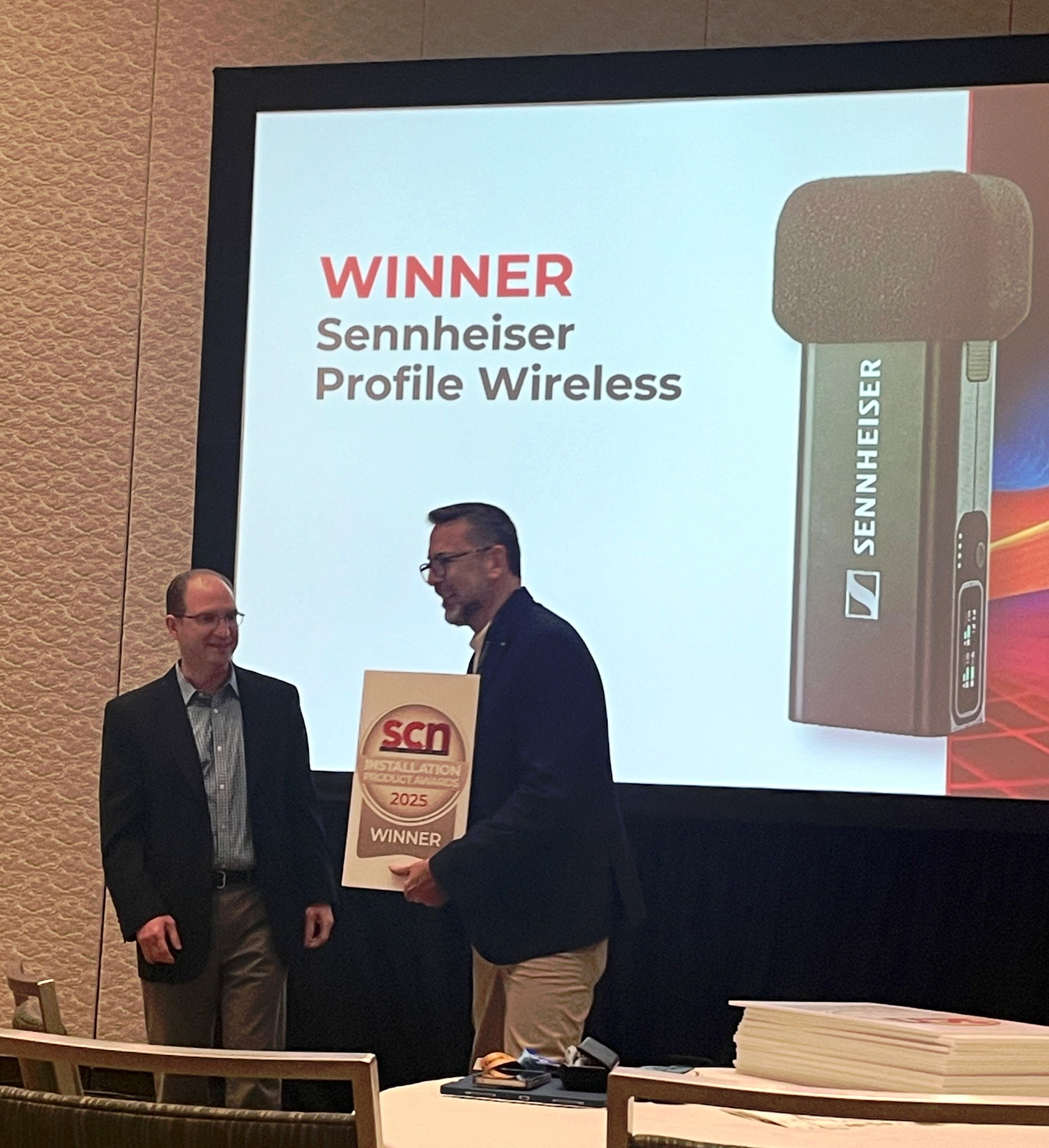 Sennheiser’s Hugo Caballero, Trade Marketing Manager, Pro Audio, accepting SCN’s Installation Product Award for the Profile Wireless 2-Channel Microphone System.