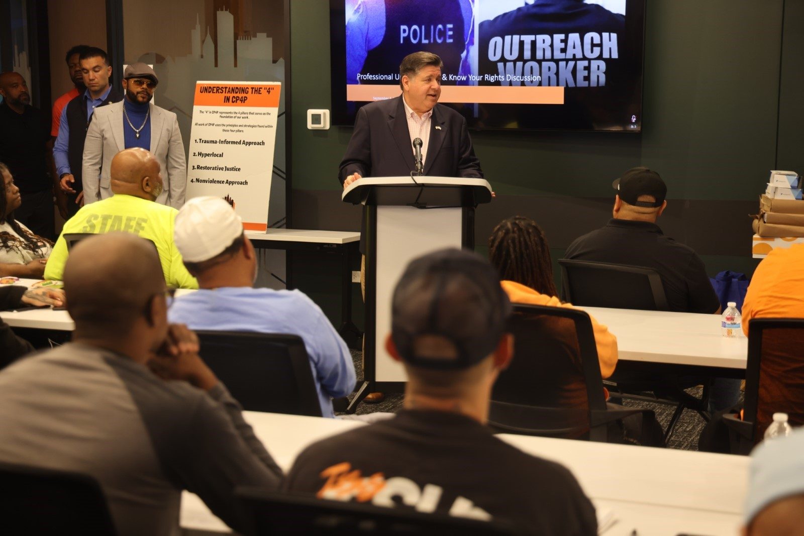 Gov. Pritzker speaks to a group of outreach workers at the Metropolitan Peace Academy. (Office of the Governor)
