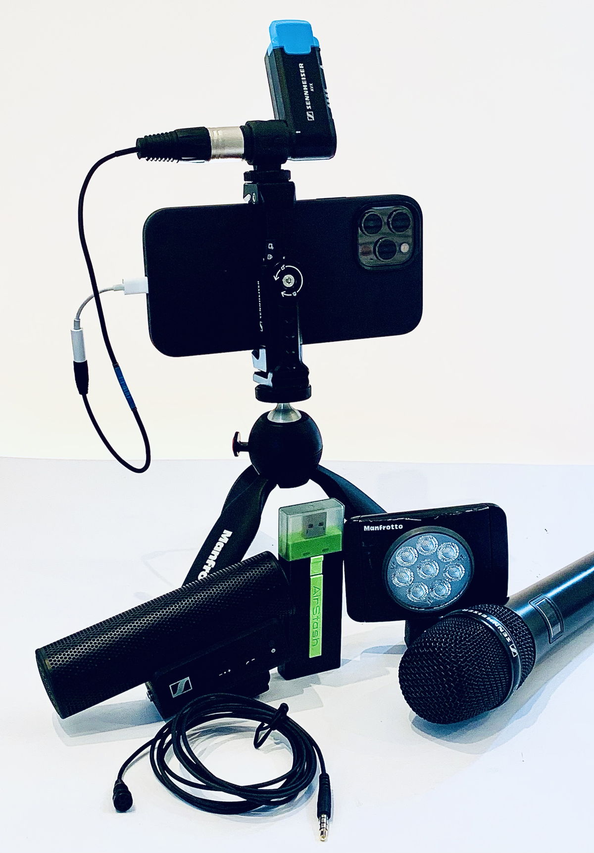 Figure 12.   Advanced Kit  with iPhone 12 Pro Max, MKE 400 Mobile Kit (includes Manfrotto PIXI and Smartphone Clamp), AVX wireless microphone system, XS Lav Mobile clip-on mic, Manfrotto Lumimuse Light, Airstash, TRS and TRRS to Lightning adaptors  (Photo credit: Ivo Burum)