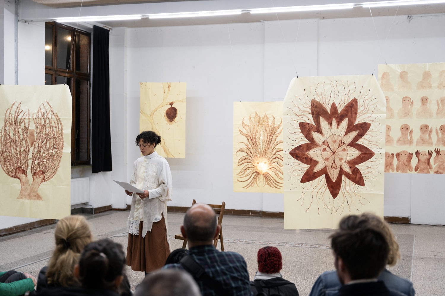 Songs for the Restless, Sadrie Alves, 2023. Performative reading and drawing series on paper installation. Photo by Brent Mertens.