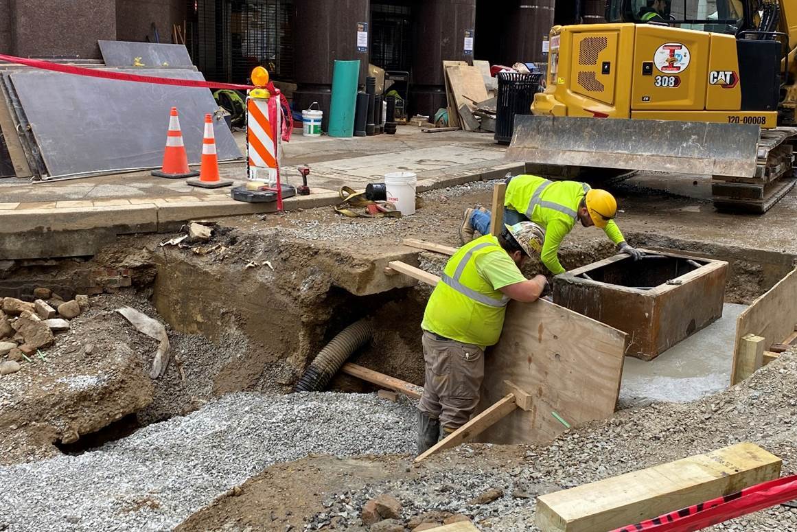 Contractors are pouring a catch basin outside of Wood Street Station Contractors are pouring a catch basin outside of Wood Street Station