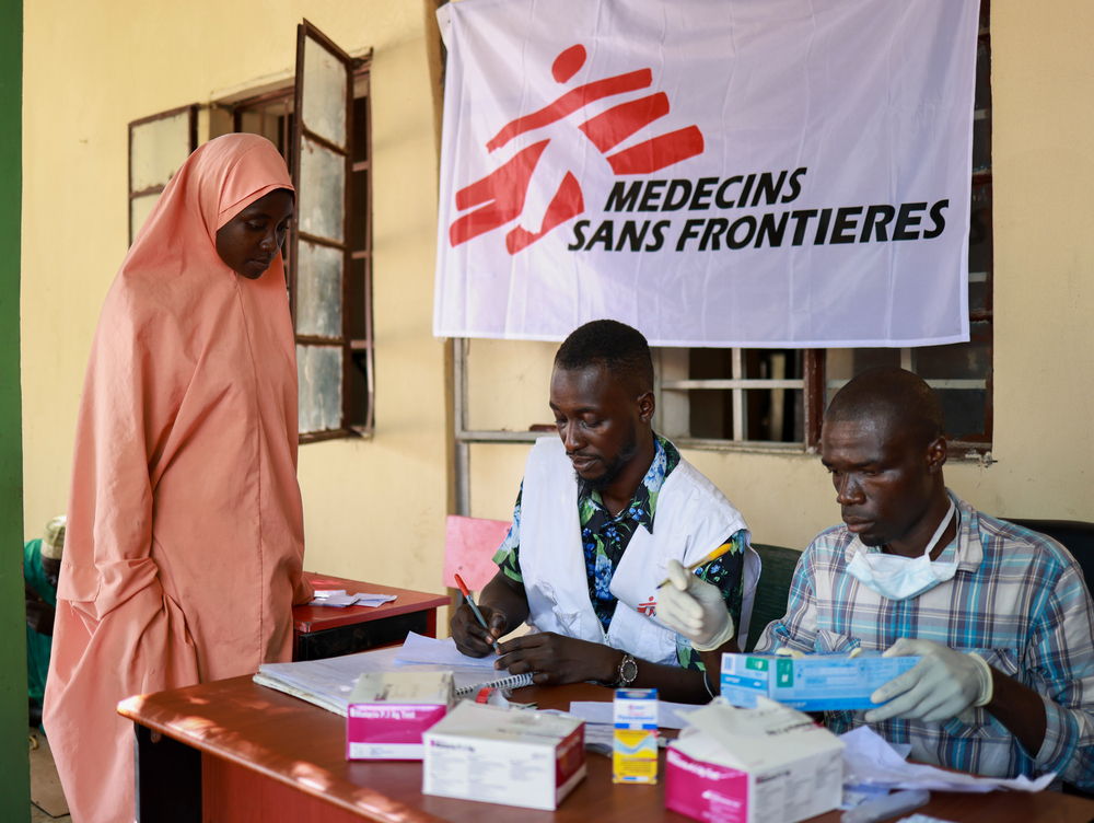 Zainab Mohammed, receiving a medical consultation at the MSF mobile clinic in the Yerwa camp. Luckily, she along with her husband and three children escaped when water flooded their house in Maiduguri, but she says that they are ill following the flood. She and her family now live in Yerwa camp, in Maiduguri and have to rely on aid. Photographer: Abba Adamu Musa | Location: Maiduguri | Date: 18/09/2024