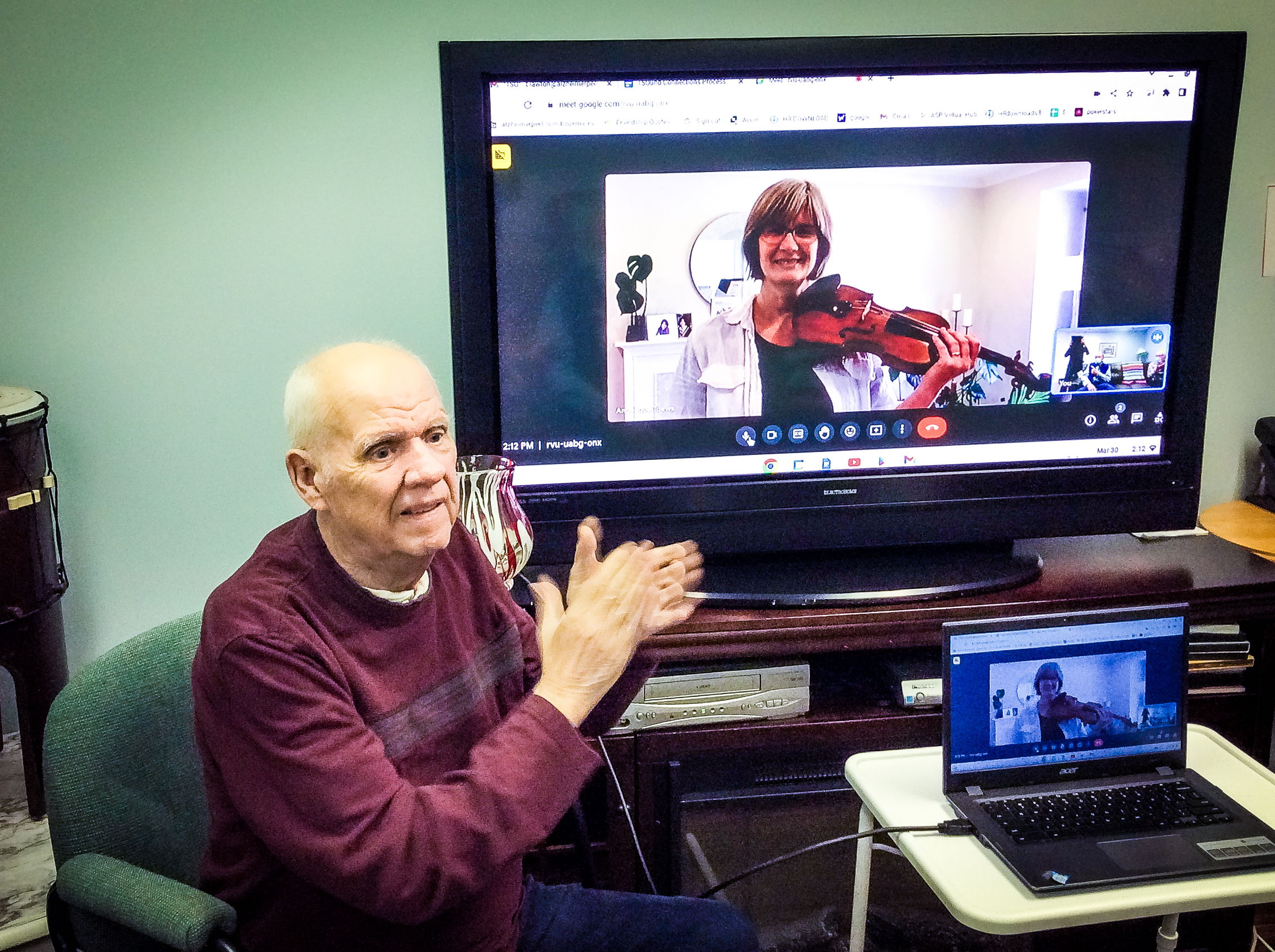 Photo caption: Angelique Toews, TSO Musician, delights a senior with her violin during a live virtual 1:1 performance. As a TSOUND Connections participant, Toews shares “Music has a way of transporting people to a different time and place, and I can see that during the TSOUND Connections calls when they remember an old favourite song or piece. I find TSOUND Connections very personally rewarding. I love to bring music to people who can't get out to concerts.”