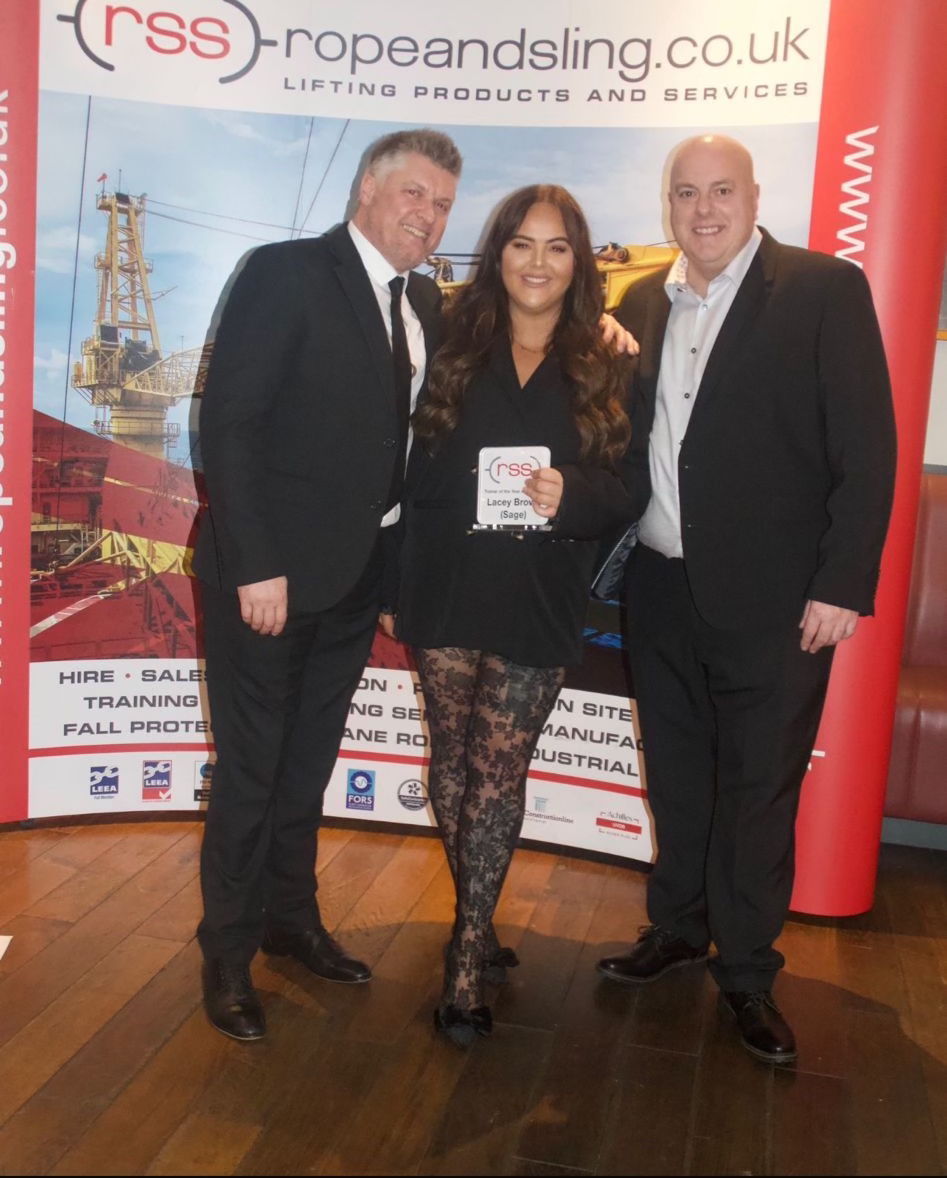 Lacey Brown won Trainer of the Year. Steve Hutin (left) and Alan Varney presented her with the coveted award.