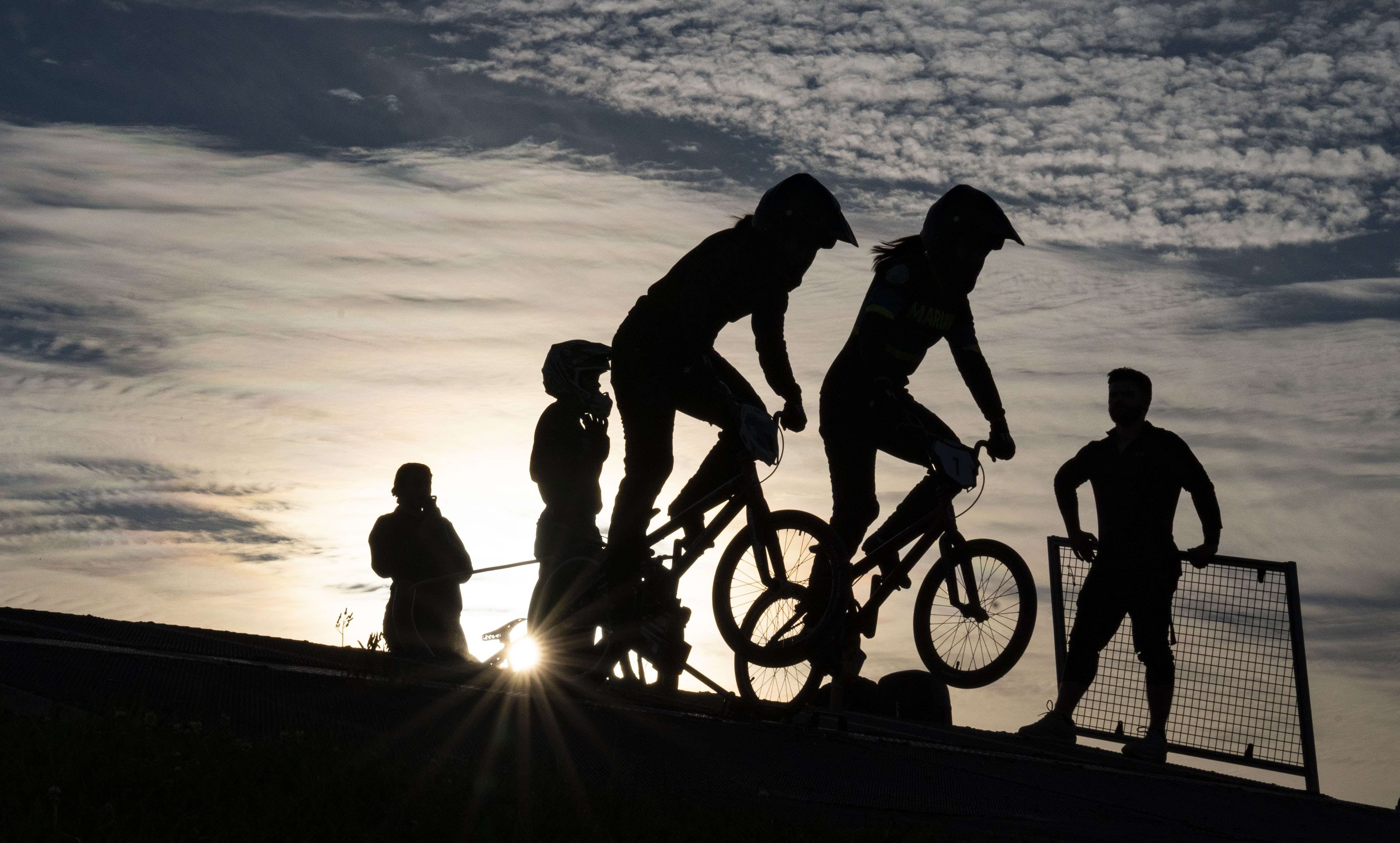 Grace Hollars / Indy Star; Alpha 9 II, FE 24-70mm F2.8 GM, 61mm, 1/2500, f/22, ISO 800; Marian University BMX riders Mya Ramos (left) and Violet Cejalvo, break from the starting gate during practice Thursday, Sept. 30, 2021, at Indy Cycloplex BMX Park, Indianapolis.