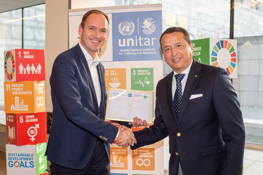 Michiel Alferink, Algemeen Directeur Athlon Belgium met Alex Mejía, Director of UNITAR's Division for People and Social Inclusion