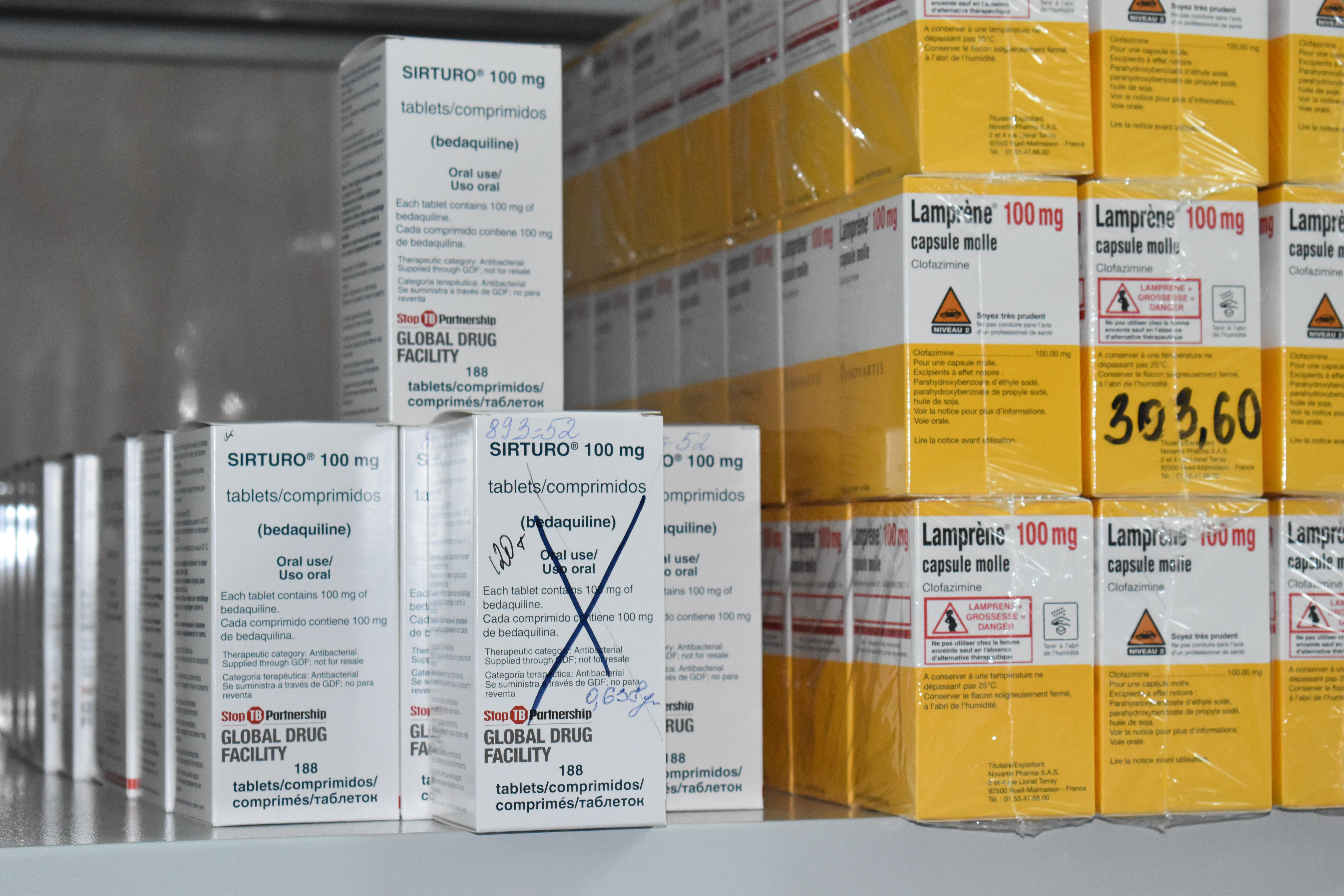 Packages with bedaquiline (white) and clofazimine (orange) in the hospital pharmacy of the Republican. Scientific and Practical Centre for Pulmonology and Tuberculosis, Minsk, Belarus. Bedaquiline and clofazimine were used for the pioneering TB-PRACTECAL clinical trial and now used for the SMARRTT operational study. TB-PRACTECAL is the first-ever multi-country, randomized, controlled clinical trial to report on the efficacy and safety of a six-month, all-oral regimen for Rifampicin-resistant tuberculosis (RR-TB). It tested a six-month regimen of bedaquiline, pretomanid, linezolid and moxifloxacin (BPaLM), against the locally accepted standard of care. The trial took place in seven sites across Belarus, South Africa, and Uzbekistan. Photographer Alexandra Sadokova. Date: 01/09/2022. Location: Belarus Packages with bedaquiline (white) and clofazimine (orange) in the hospital pharmacy of the Republican. Scientific and Practical Centre for Pulmonology and Tuberculosis, Minsk, Belarus. Bedaquiline and clofazimine were used for the pioneering TB-PRACTECAL clinical trial and now used for the SMARRTT operational study. TB-PRACTECAL is the first-ever multi-country, randomized, controlled clinical trial to report on the efficacy and safety of a six-month, all-oral regimen for Rifampicin-resistant tuberculosis (RR-TB). It tested a six-month regimen of bedaquiline, pretomanid, linezolid and moxifloxacin (BPaLM), against the locally accepted standard of care. The trial took place in seven sites across Belarus, South Africa, and Uzbekistan. Photographer Alexandra Sadokova. Date: 01/09/2022. Location: Belarus