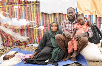 Abdul Muhaymen Moussa, his wife and one of his daughters, in Daman Camp, Al Gedaref State. November 2024.