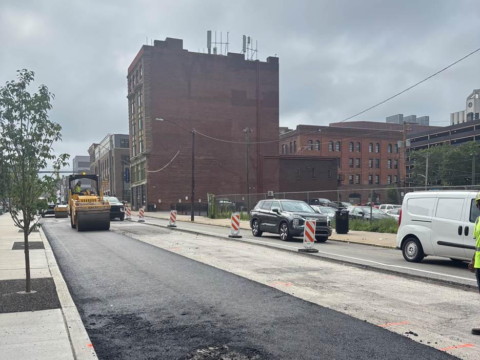 Paving underway on the northern (right) and center lane of Fifth Avenue in Uptown