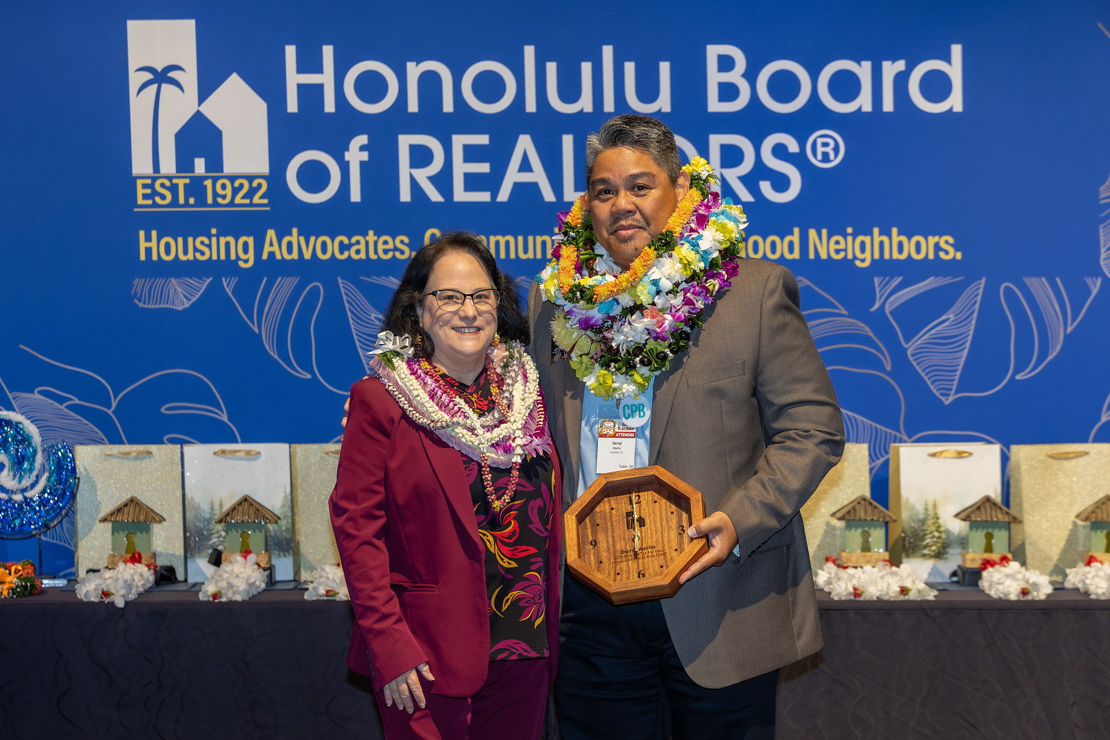 Honolulu Board of REALTORS® CEO Suzanne Young with 2024 REALTOR® of the Year Award recipient Darryl Macha, Broker-In-Charge at Locations, LLC. (Photo Courtesy: Honolulu Board of REALTORS®)