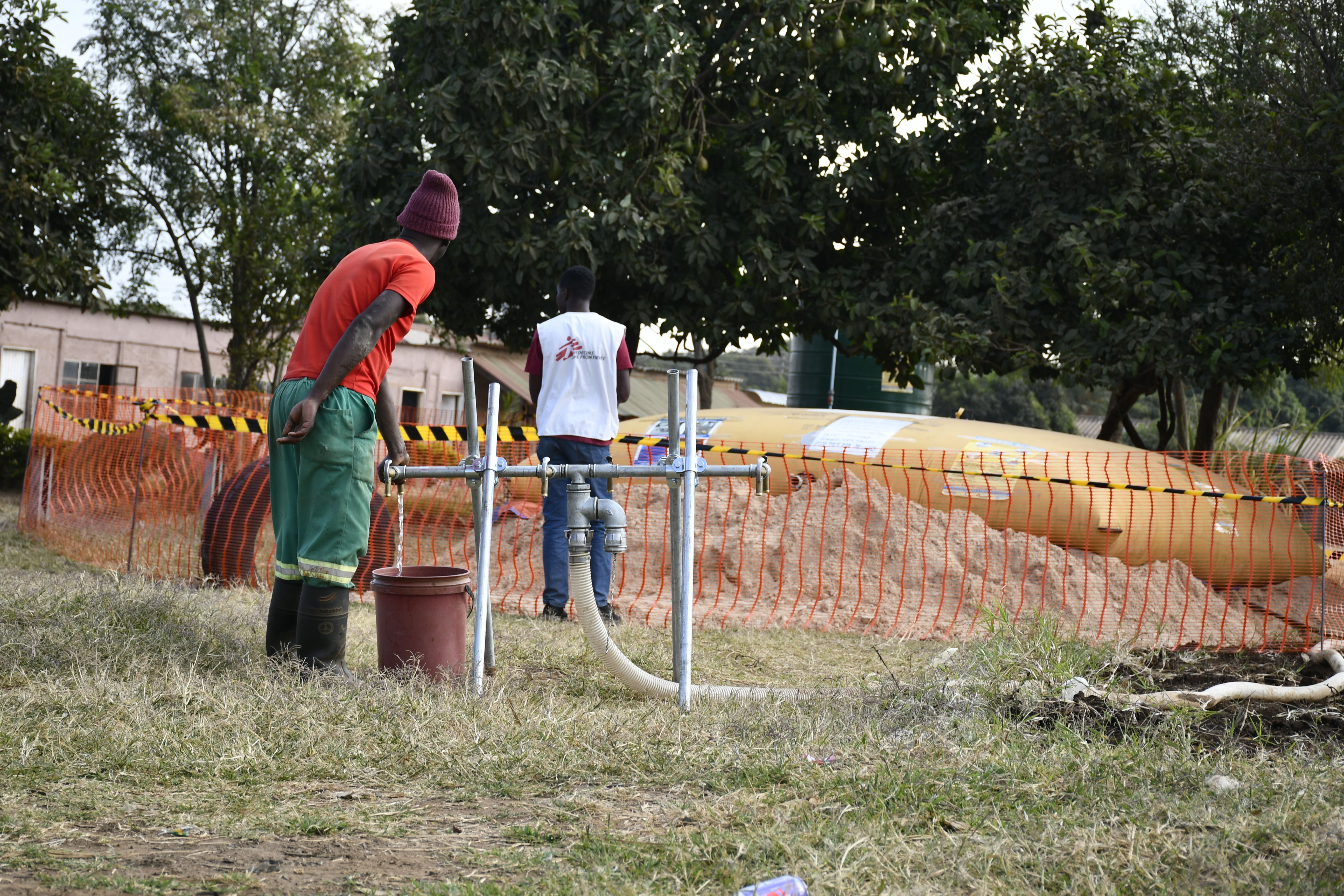 Glen View Resident fetching water froma water bladder | Location: Zimbabwe | Date 2023 | Photographer: MSF