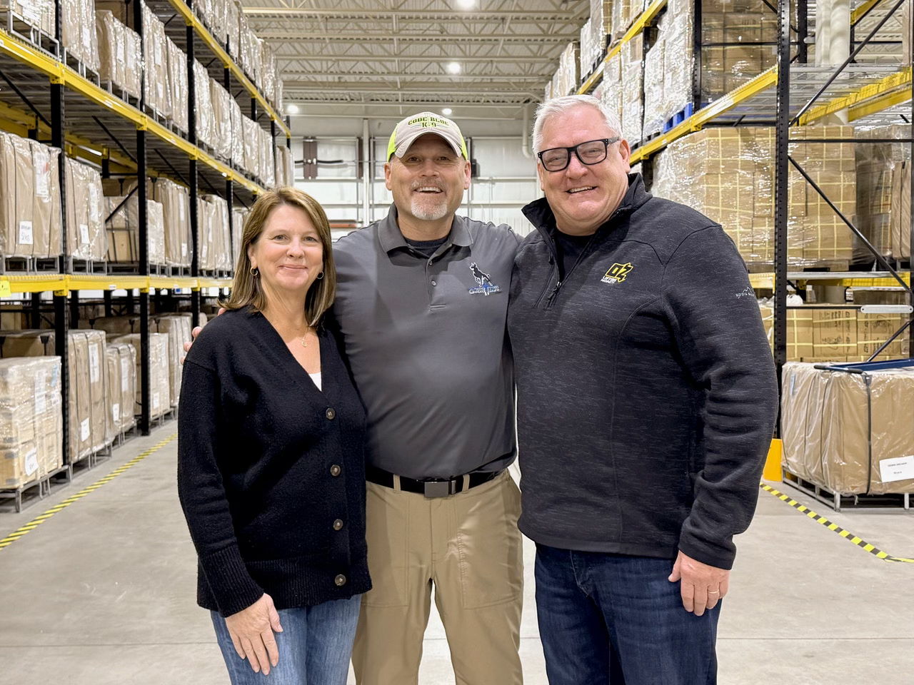 OZ Lifting’s Steve and Jane Napieralski, either side of Trace Erickson, of Code Blue K9.