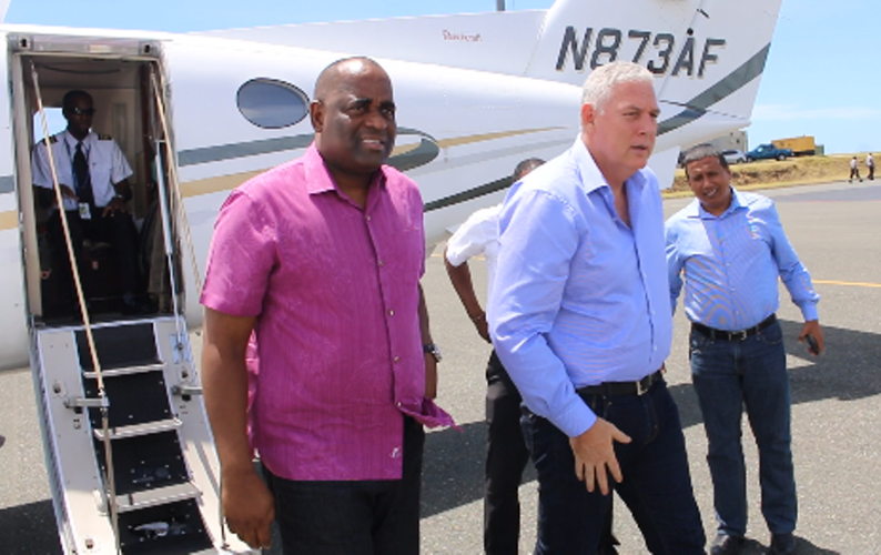 Prime Minister Skerrit and Prime Minister Chastanet disembark aircraft in the British Virgin Islands.