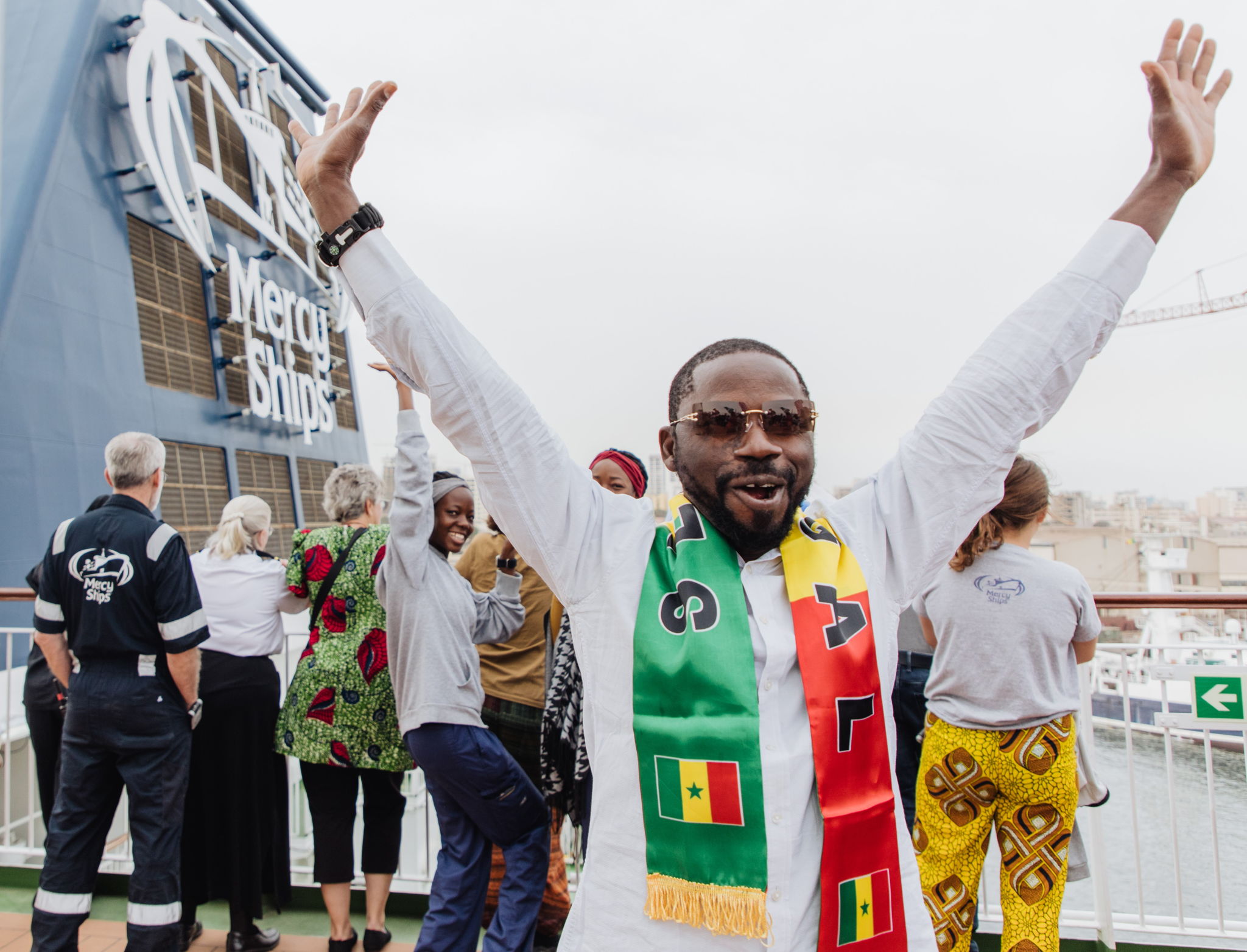 Celebrations commence in Dakar upon the ship's arrival.