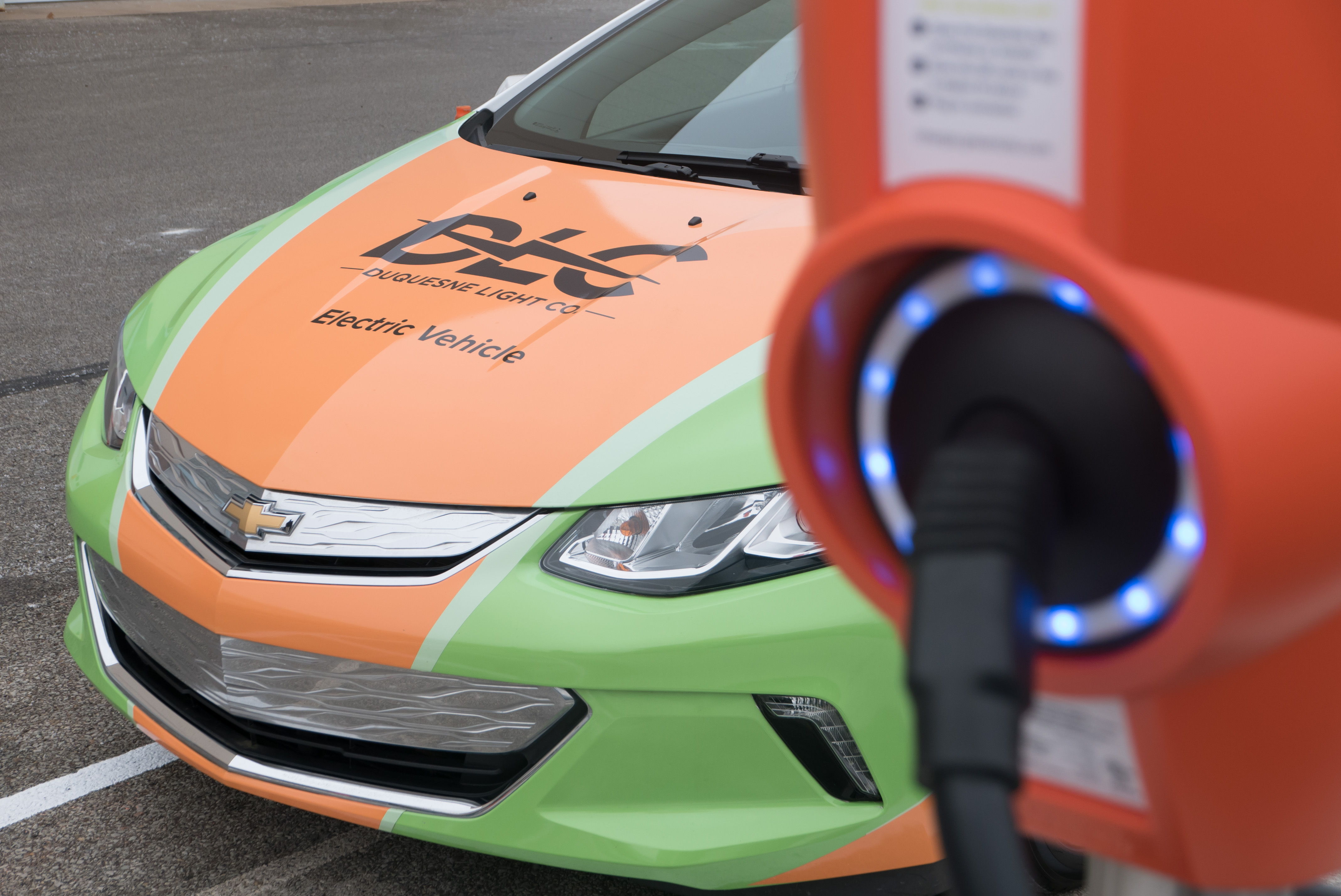 Duquesne Light Co. is empowering all of its customers to experience the benefits of electric mobility. Photo: An electric powered Chevy Volt parked at a charging station outside of a DLC facility is part of the utility&#x27;s electric vehicle fleet.
