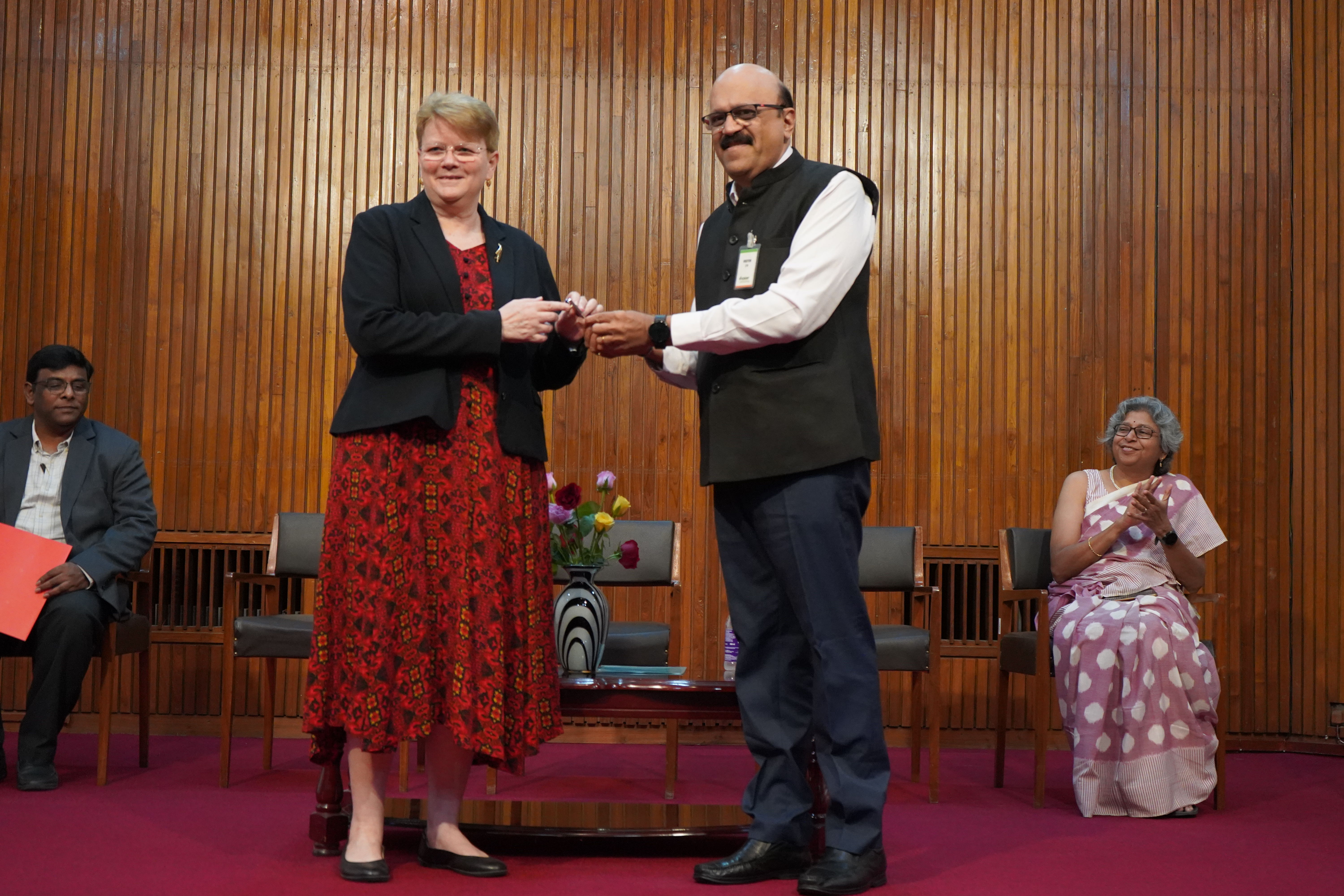 Director General of ICRISAT, Dr Jacqueline Hughes, receives keys from Mr Sharath Kamath, Zonal Head, IDBI Bank.