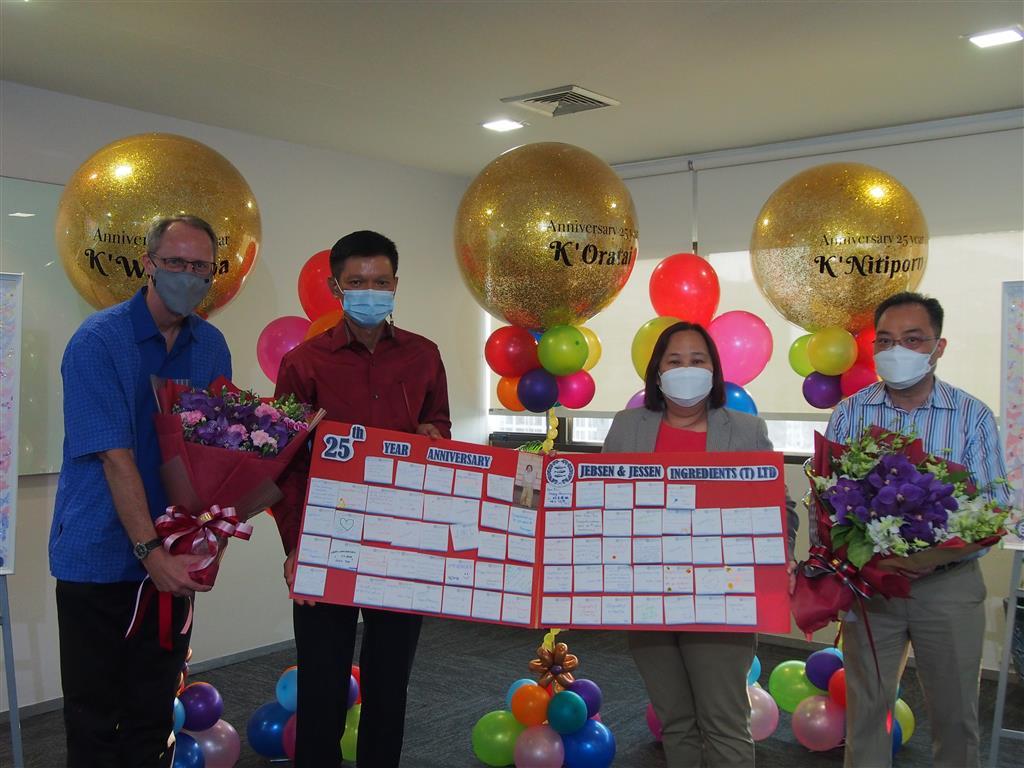 Our CEO, Ms. Siew Tin, receives flowers and a message board by our colleagues from JJIT
