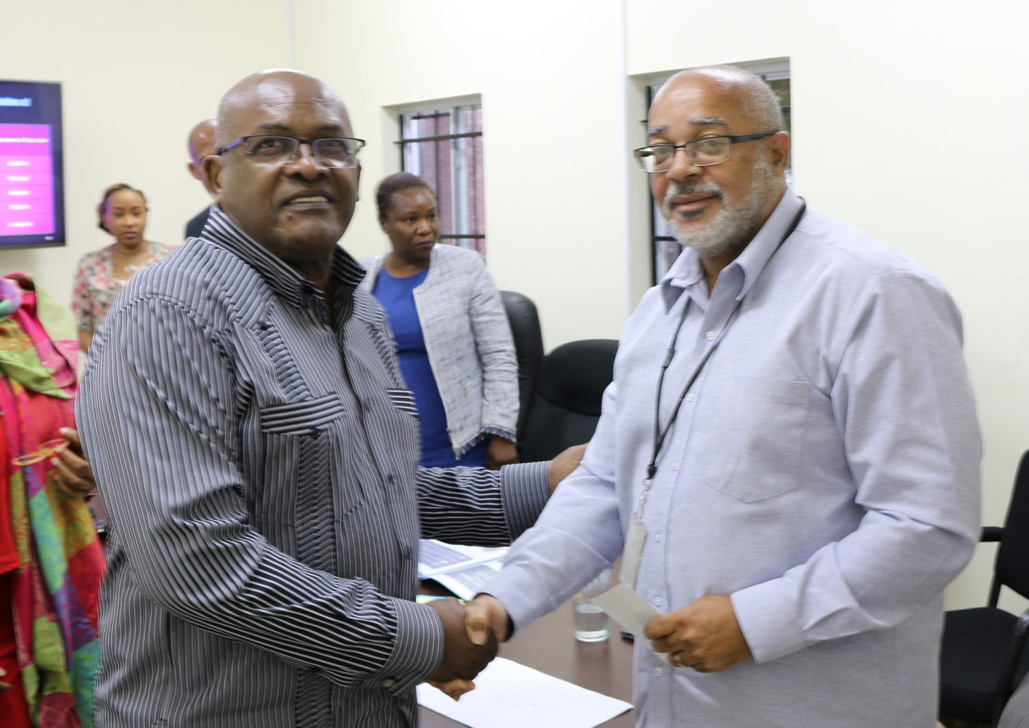 OECS Director General, Dr. Didacus Jules and CGSS General Director, Mr. Henri Yacou, shake hands at the CGSS visit to OECS Headquarters in June 2018.