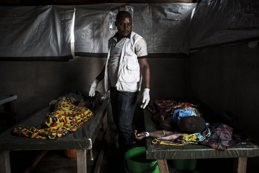 An MSF nurse checks on cholera patients in an MSF-supported cholera centre on the shores of Lake Albert on 5 March 2018. The town of Tchomia is the one of the main towns for thousands of Congolese IDPs to flee to refugee camps on the shores of Lake Albert in Uganda. After the cholera outbreak in the refugee camps in Uganda, there is a fear of a subsequent outbreak in Tchomia, which would affect thousands of IDPs taking refuge along the shoreline of Lake Albert in DRC. PHOTO/JOHN WESSELS
