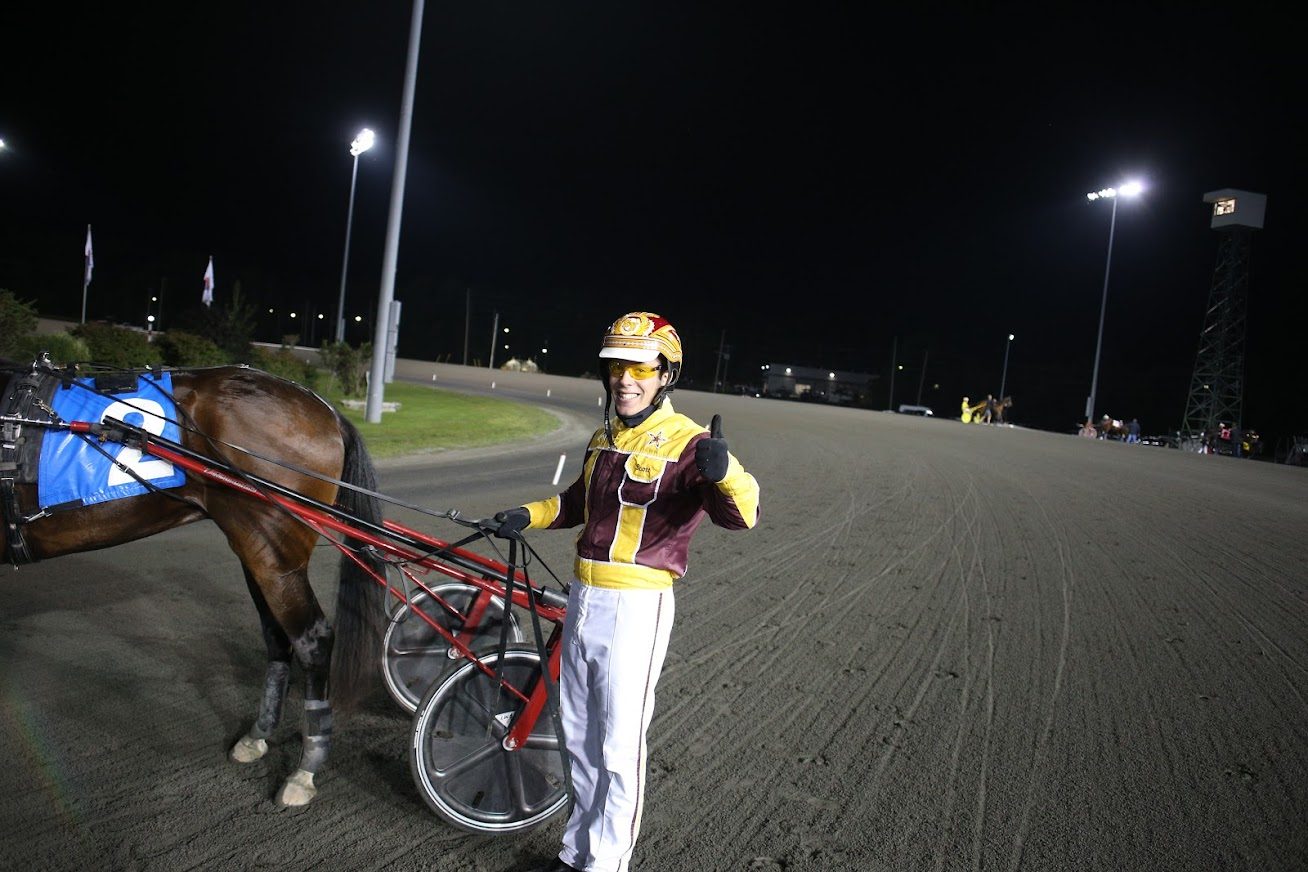 Scott Young in the Woodbine Mohawk Park winner's circle with On A Streak. (New Image Media)