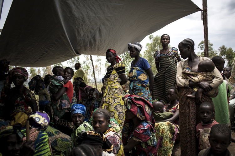 Internally Displaced Congolese women and children wait outside a makeshift MSF health clinic on 2 March 2018 in Telega. ©John Wessels/MSF Internally Displaced Congolese women and children wait outside a makeshift MSF health clinic on 2 March 2018 in Telega. ©John Wessels/MSF