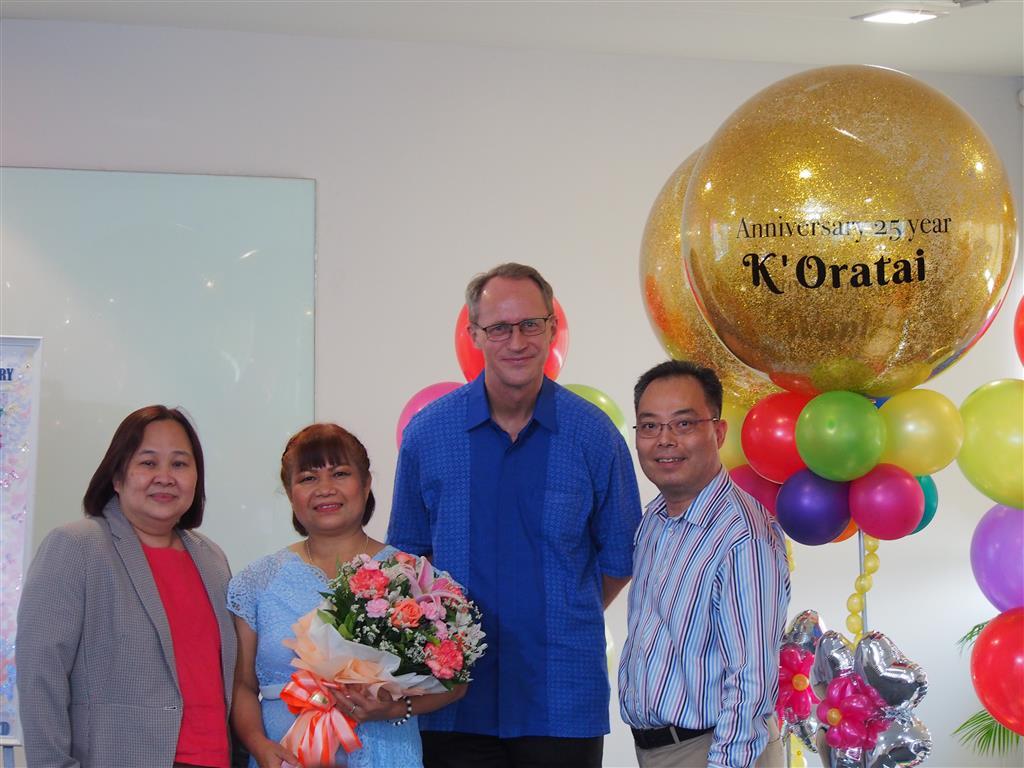 Khun Oratai receiving her flowers and pin from our Chairman, CEO and MD