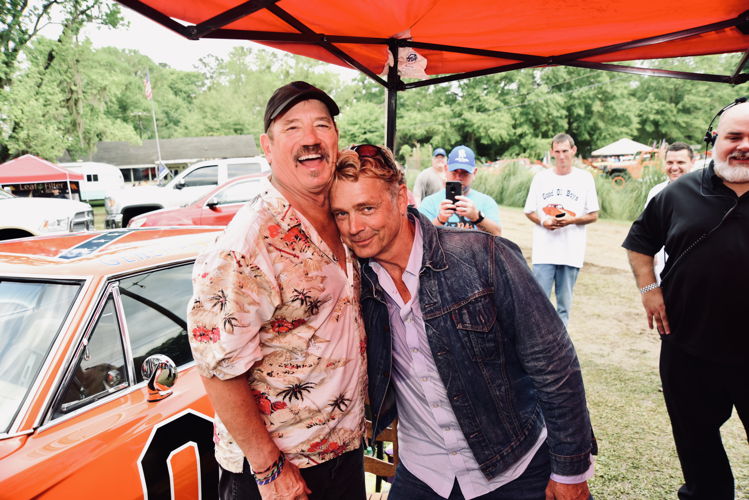 The Dukes of Hazzard stars Tom Wopat and John Schneider reunite at Bo's Extravaganza. (Photo Credit: Allen Clark)
