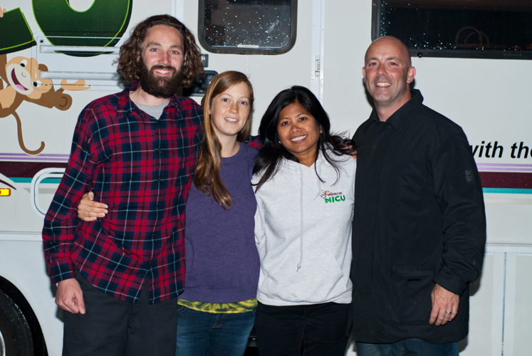 Elanie and Tim Purkis (3rd and 4th from left) stand next to a family who stayed in the FON motor home while their baby was in the Mercy San Juan Hospital NICU.