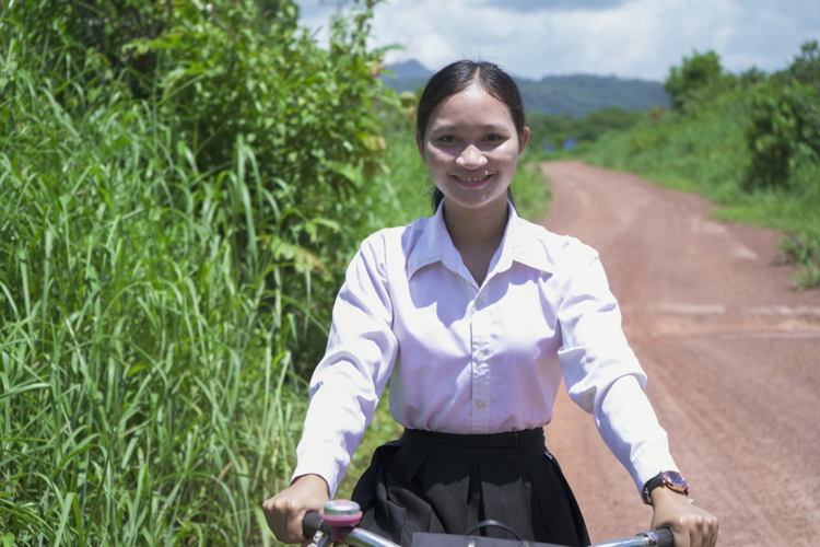 Kary rides her bicycle to school in Cambodia ©Plan International