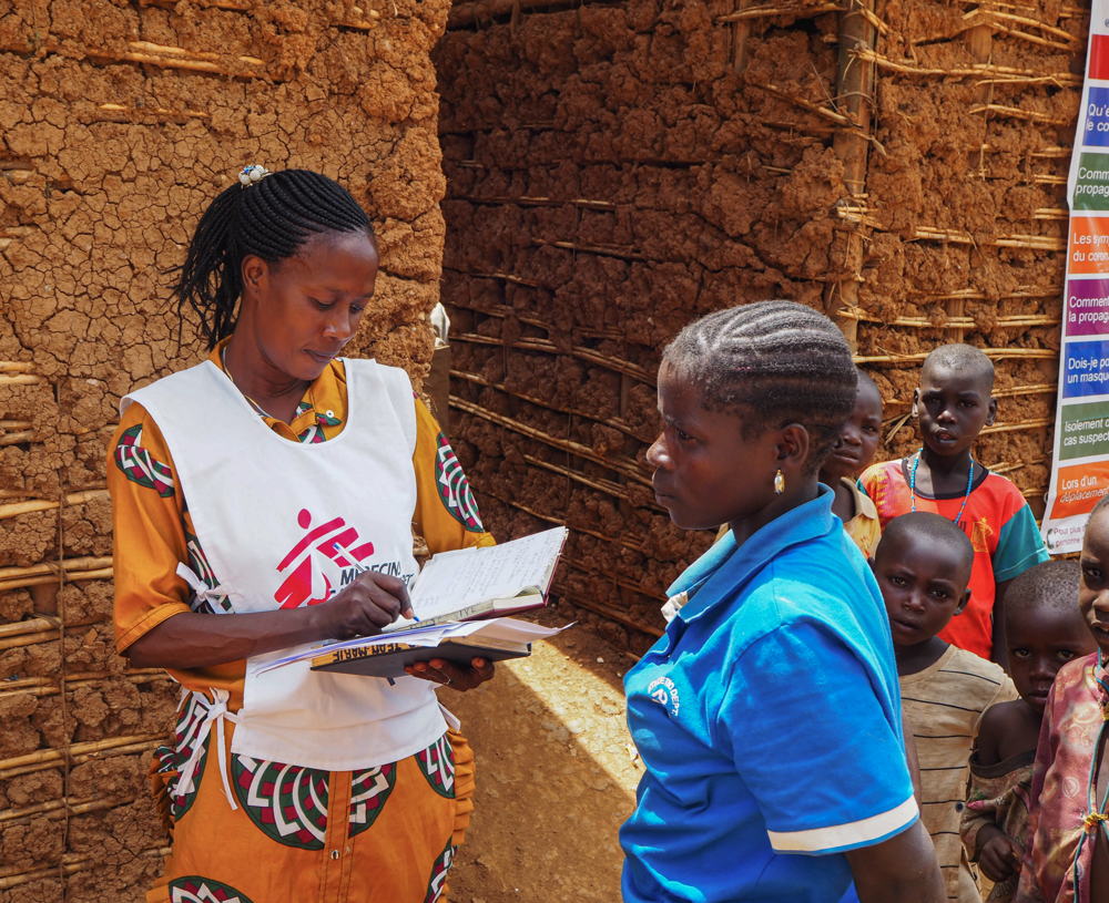 Rose, a health promoter working with MSF, has also been an internally displaced person since the early 2000s when the conflict first started. She left her village, moved to Bunia and started working with MSF a long time ago. She is working on a census of the newly arrived IDPs in the camp of CEKA20, to give them non-food item kits. Credit MSF/Avra Fialas, 20 May 2020