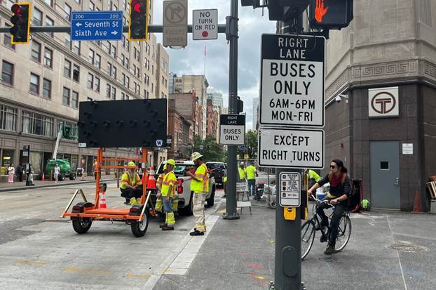 Message board and traffic signs recently placed at Sixth and Liberty avenues