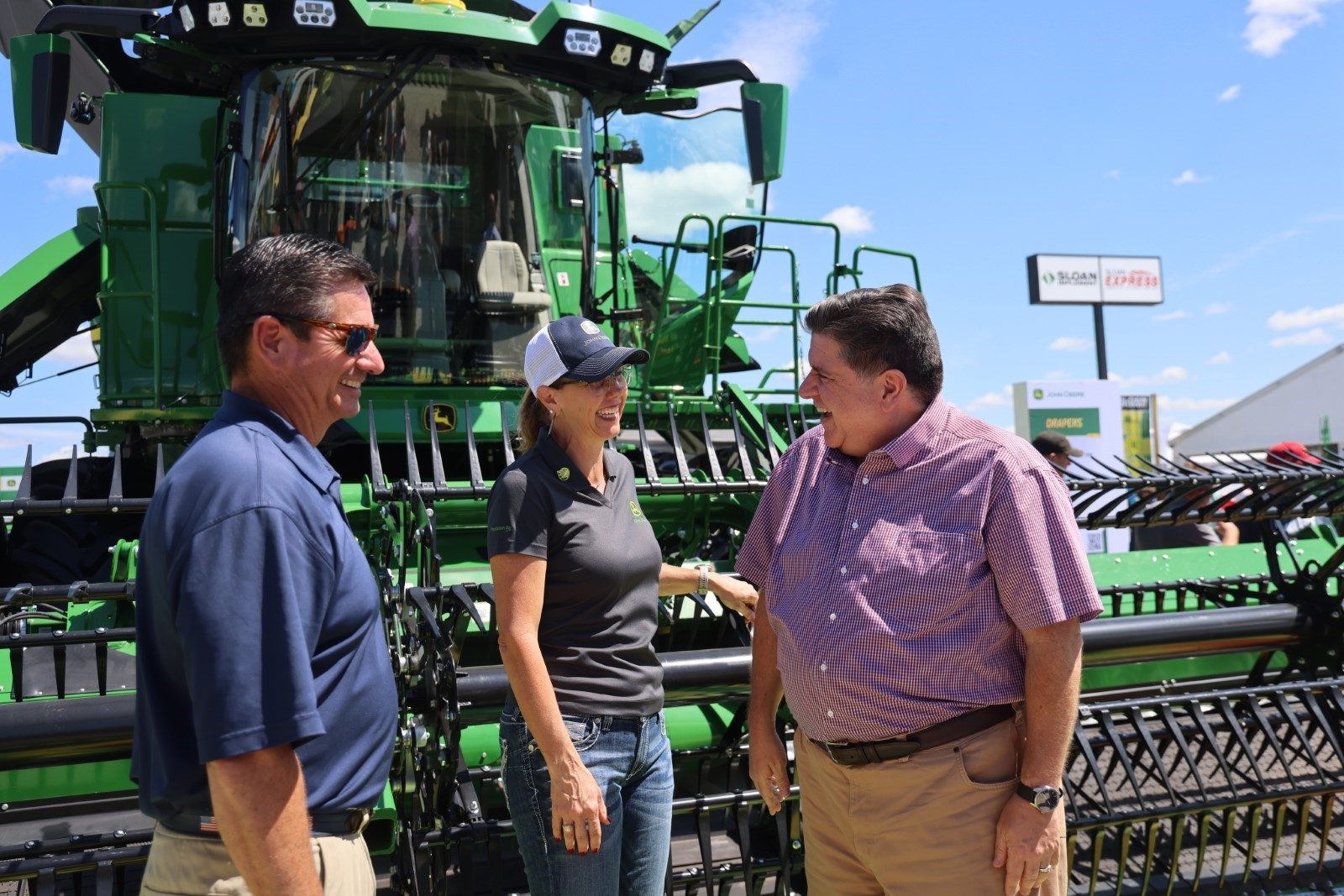 Gov. Pritzker and Jerry Costello II, Director of the Illinois Department of Agriculture, meet with exhibitors at the 2025 Farm Progress Show in Decatur after announcing a $2 billion investment from Cronus Chemicals LLC (Cronus) to construct a new fertilizer production facility in Tuscola. (Office of the Governor)