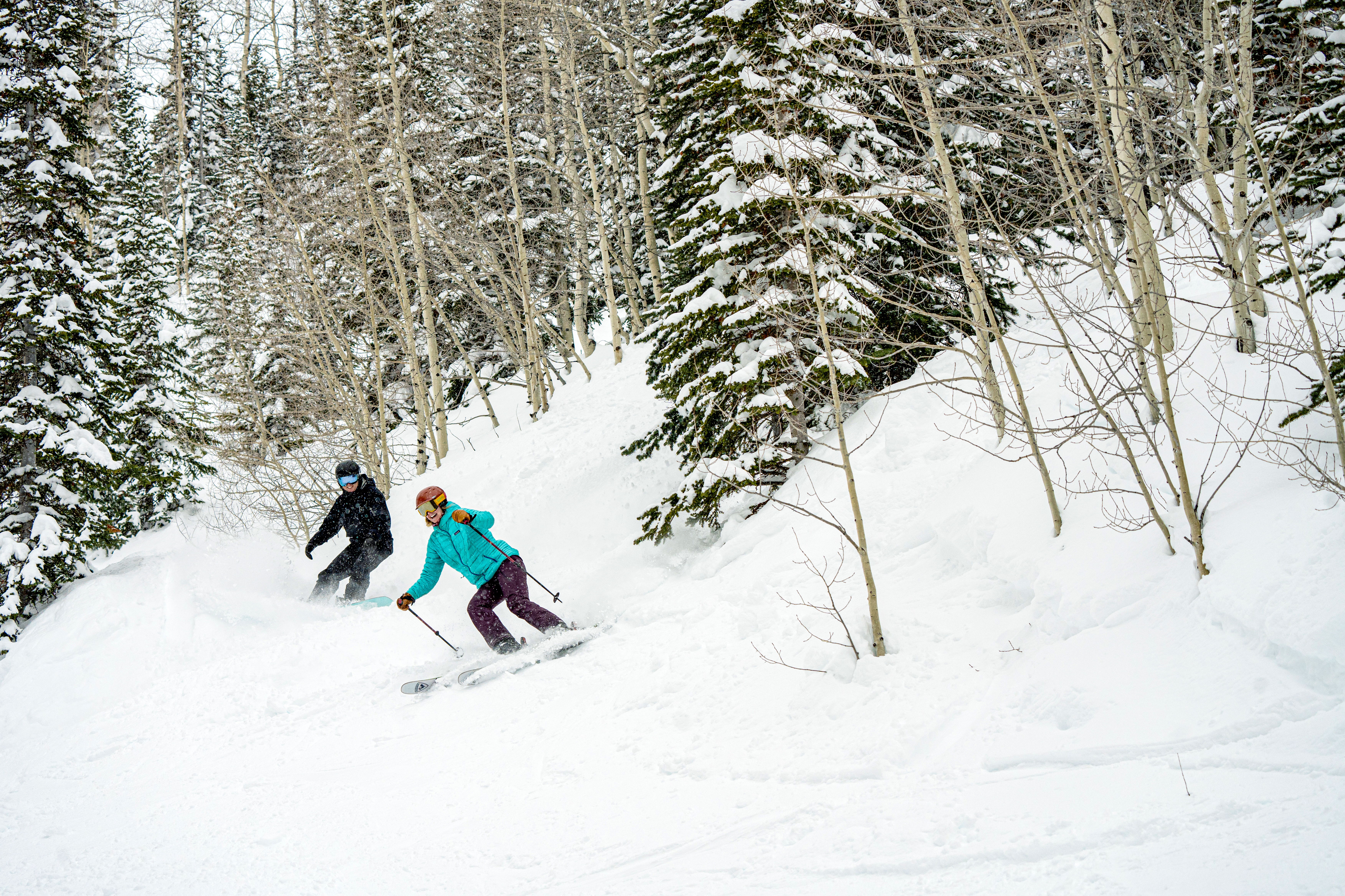 A skier and snowboarder enjoy the slopes at Powderhorn Mountain Resort. Photo courtesy: Powderhorn Mountain Resort.