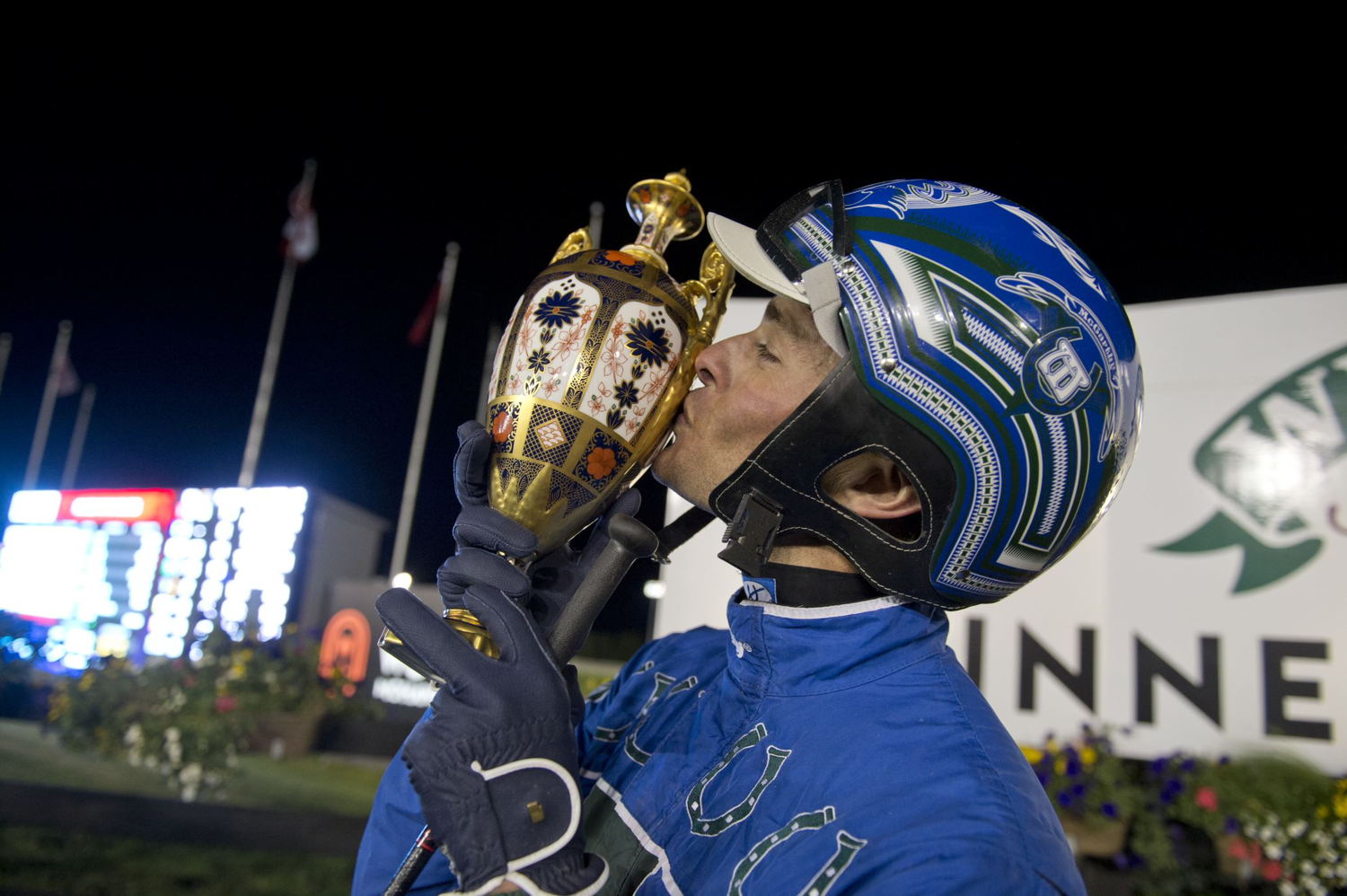 Todd McCarthy kisses the Pepsi North America Cup trophy. (New Image Media)